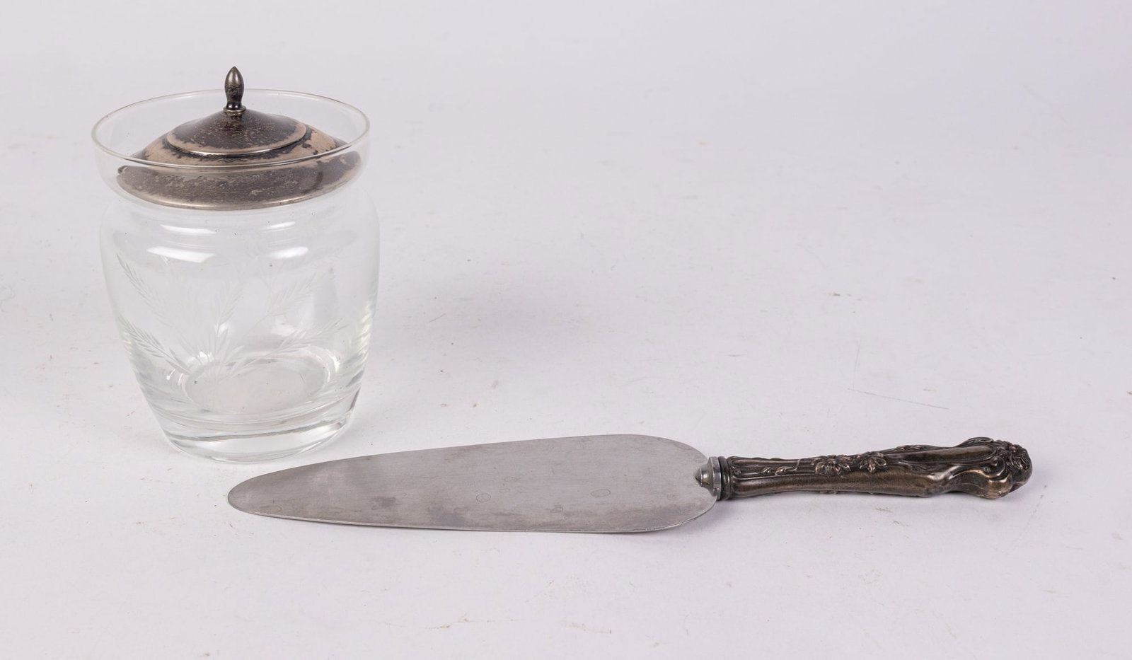 Web Sterling Sugar Bowl and Sterling Handled Server: Web Sterling Sugar Bowl and Sterling Handled Server: Sugar bowl lid marked Web Sterling and weighs 16.4 grams. The server is marked sterling handle.SizeSugar Bowl: 4.5" H. Server: 9" LLiterature