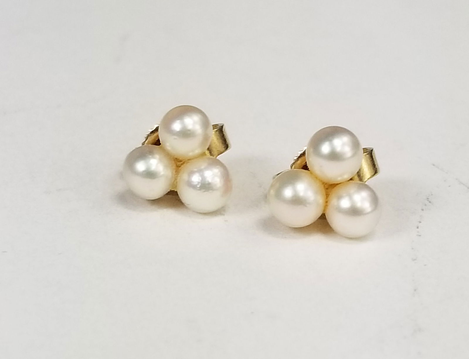 14K Gold Pearl Cluster Earrings: 14K Gold Pearl Cluster Earrings, marked 14K, total weight 1.1 grams Literature Brooks Auction is not responsible for outbids. Questions? Call the office at (856) 694-2960 or email us directly at info