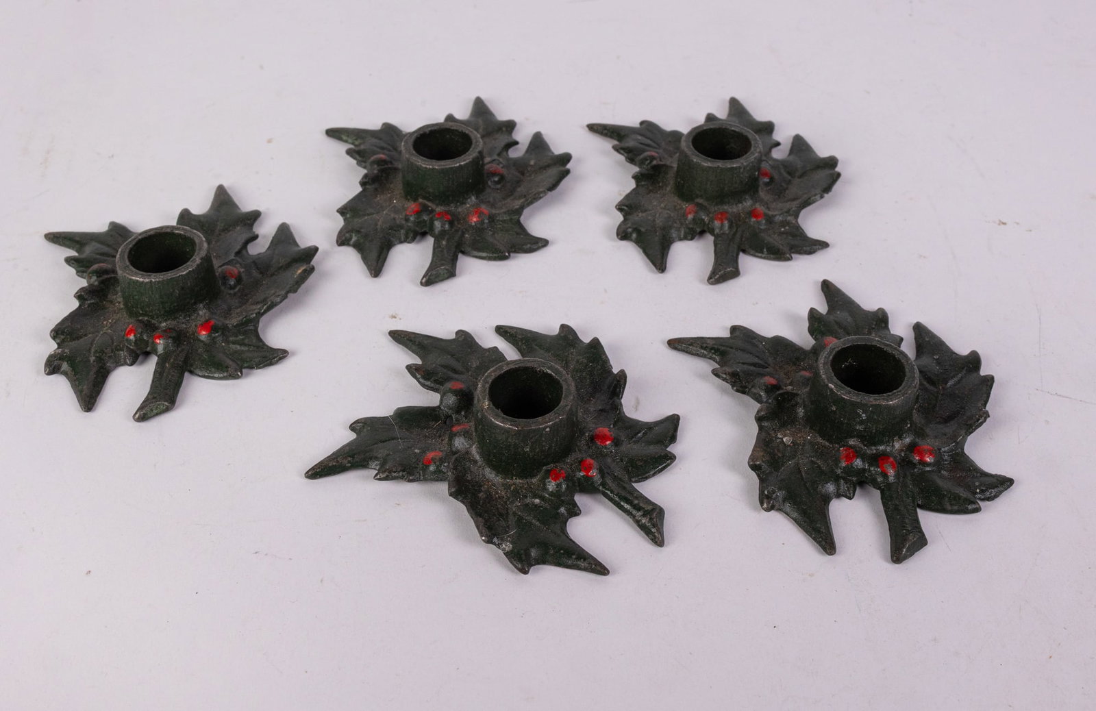 Antique 1920's Holly Cast Iron Candle Holders: Antique 1920's Holly Cast Iron Candle Holders Size 7" x 12" x 12" Literature Brooks Auction is not responsible for outbids. Questions? Call the office at (856) 694-2960 or email us directly at info@