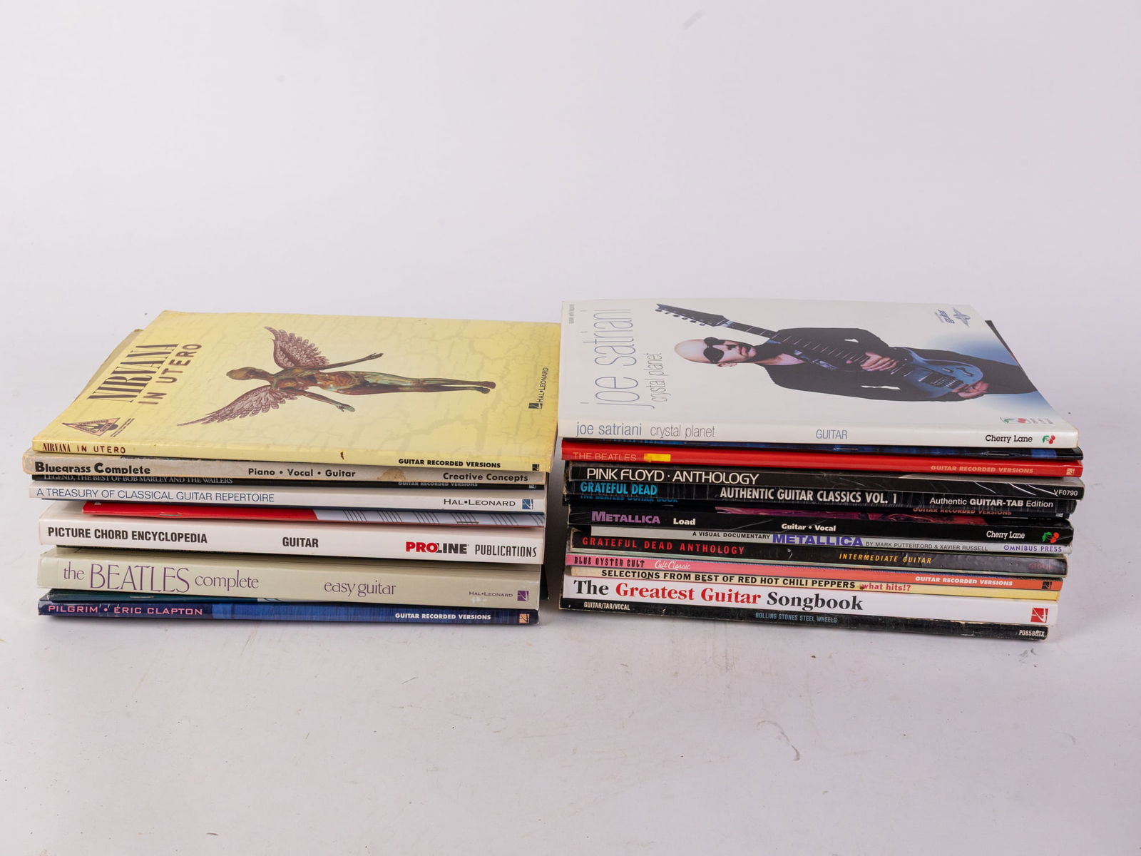 Lot of Classic Rock Song Books: Lot of Classic Rock Song Books: Includes songbooks for Rolling Stones, The Beatles, Grateful Dead, Metallica, and more, all for various instruments. Size 7" x 12" x 12" Literature Brooks Auction ̵