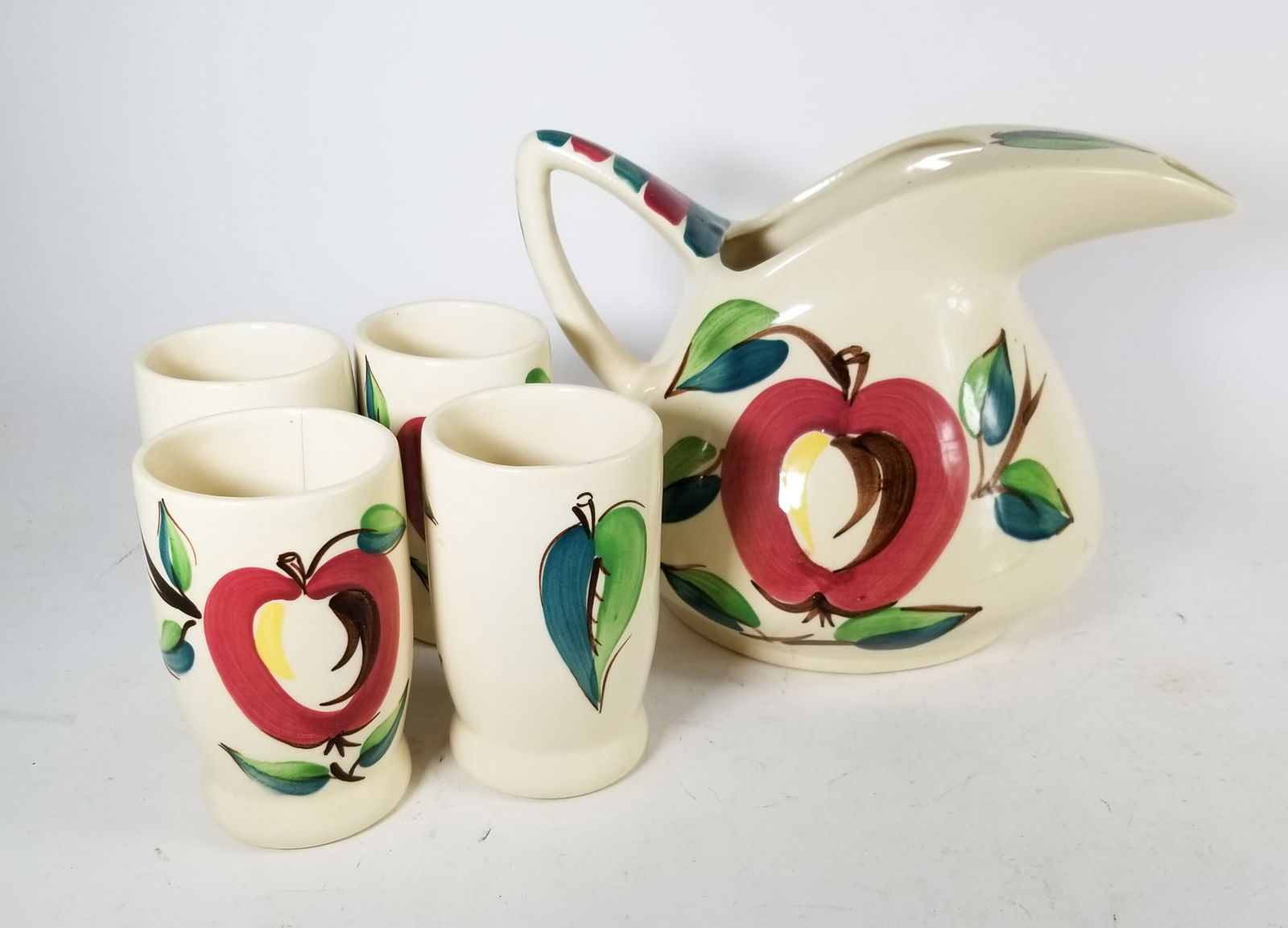 Brinton Slipware Pitcher with Cups: Brinton Slipware Pitcher with CupsSize7" x 12" x 12"LiteratureBrooks Auction – Online Auction Terms & Conditions
