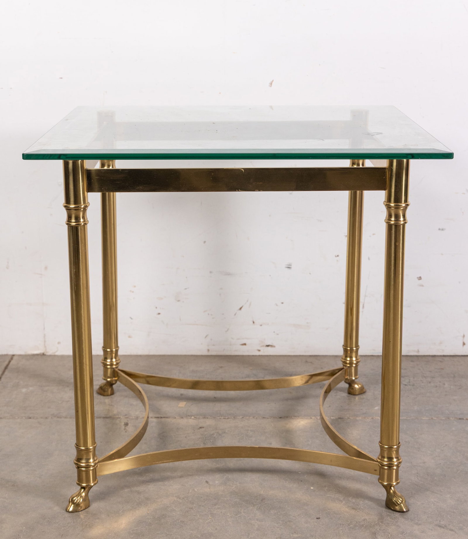 Hollywood Regency Brass Toned Glass Top Side Table: Hollywood Regency Brass Toned Glass Top Side Table Size 22" x 24" x 24" Literature Brooks Auction – Online Auction Terms & Conditions ————————R