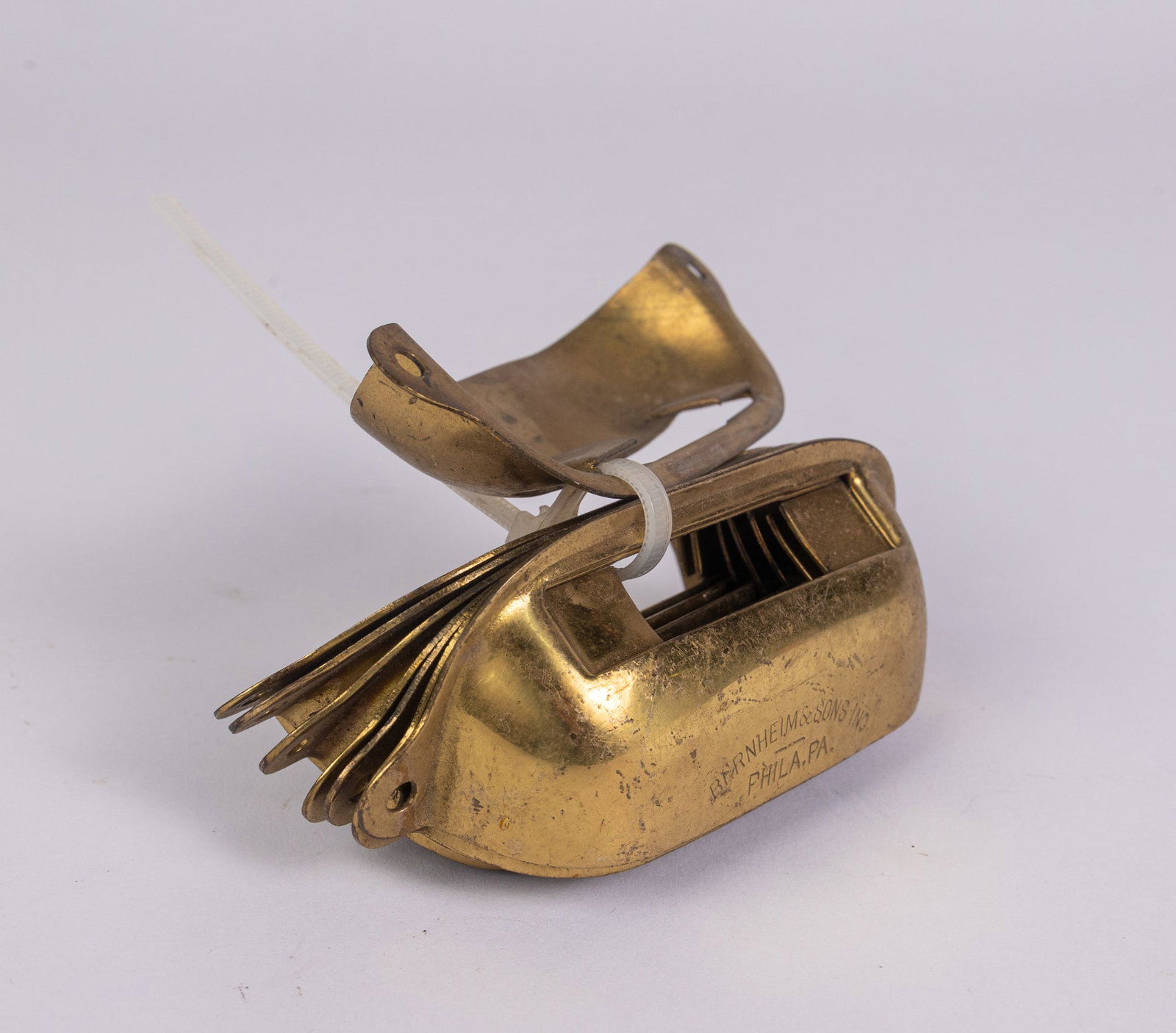 Bernheim & Sons Inc. Phila. PA. Set of Eight Brass Drawer Pulls: Bernheim & Sons Inc. Phila. PA. Set of Eight Brass Drawer PullsSize4" x 2" x 1"LiteratureBrooks Auction – Online Auction Terms & Conditions