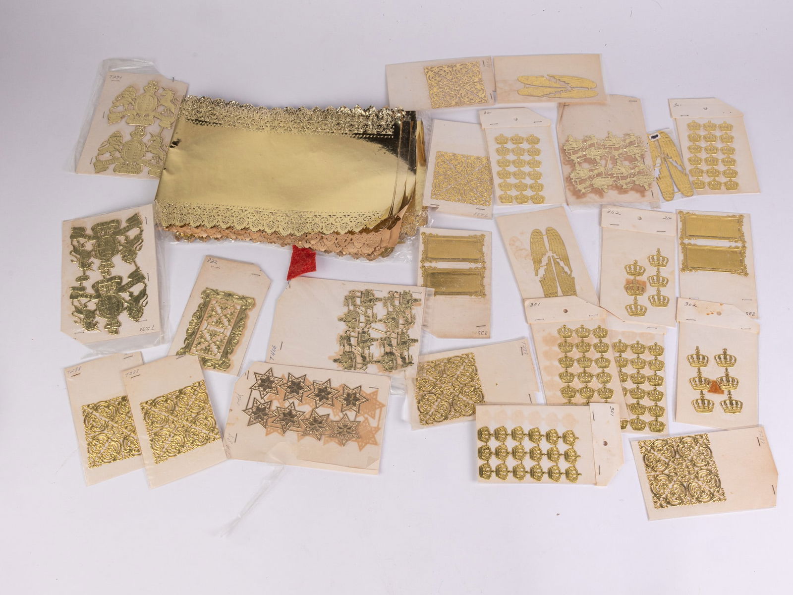 Vintage Gold Toned Die Cut Christmas Decorations: Vintage Gold Toned Die Cut Christmas DecorationsSize7" x 12" x 12" (box size)LiteratureBrooks Auction – Online Auction Terms & Conditions Contact: (856) 694-2960 | info@brooks.auction READ