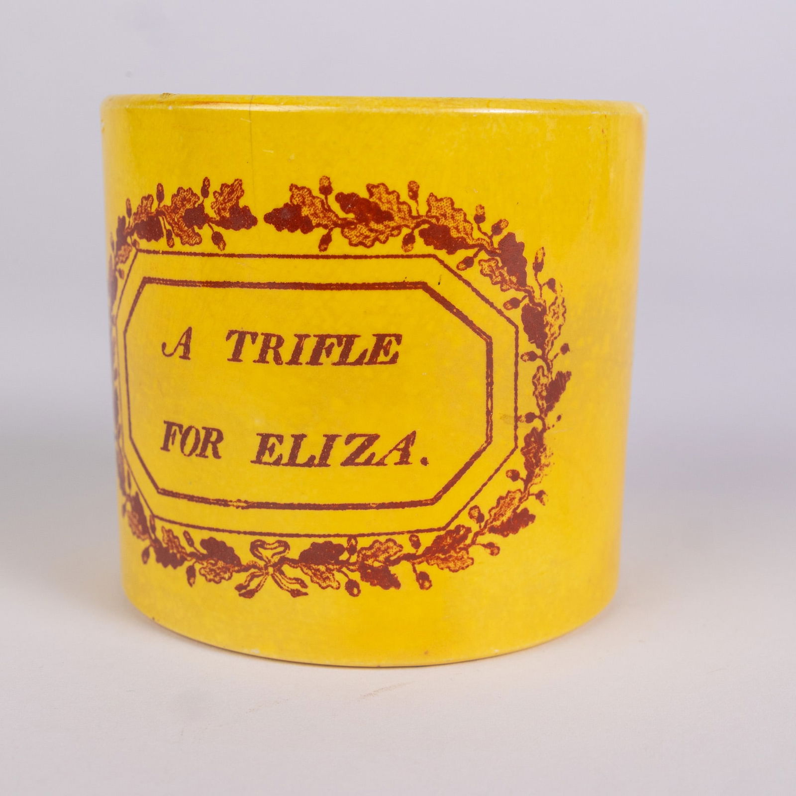 Antique Early Childs Transferware Mug "A Trifle For Eliza.": Antique Early Childs Transferware Mug "A Trifle For Eliza."Size3" x 3" x 4"LiteratureBrooks Auction – Online Auction Terms & Conditions Contact: (856) 694-2960 | info@brooks.auction READ BEFORE