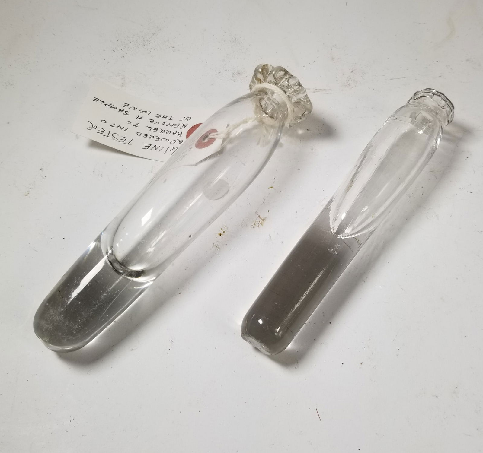 Pair of Vintage Hand Blown Glass Wine Tasting Vessels: Pair of Vintage Hand Blown Glass Wine Tasting VesselsSize6" HLiteratureBrooks Auction – Online Auction Terms & Conditions Contact: (856) 694-2960 | info@brooks.auction READ BEFORE YOU BID: We