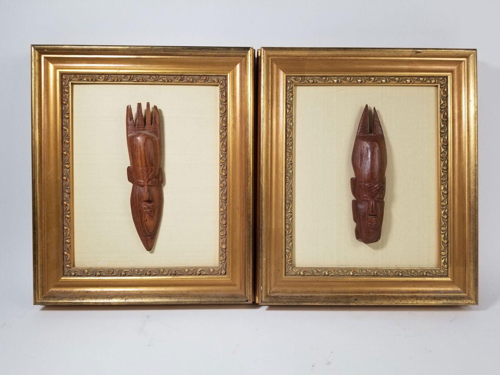 Pair of Carved Miniature African Masks in Ornate Gold Frames: Pair of Carved Miniature African Masks in Ornate Gold FramesSize13" x 11.5"LiteratureBrooks Auction – Online Auction Terms & Conditions Contact: (856) 694-2960 | info@brooks.auction READ BEFORE