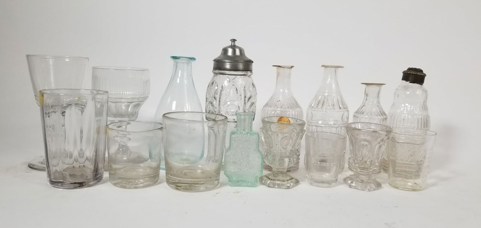 Antique Glass & Bottle Assortment ft Turlington Balsam Bottle: Antique Glass & Bottle Assortment ft Turlington Balsam BottleSize7" x 12" x 12"LiteratureBrooks Auction – Online Auction Terms & Conditions Contact: (856) 694-2960 | info@brooks.auction READ