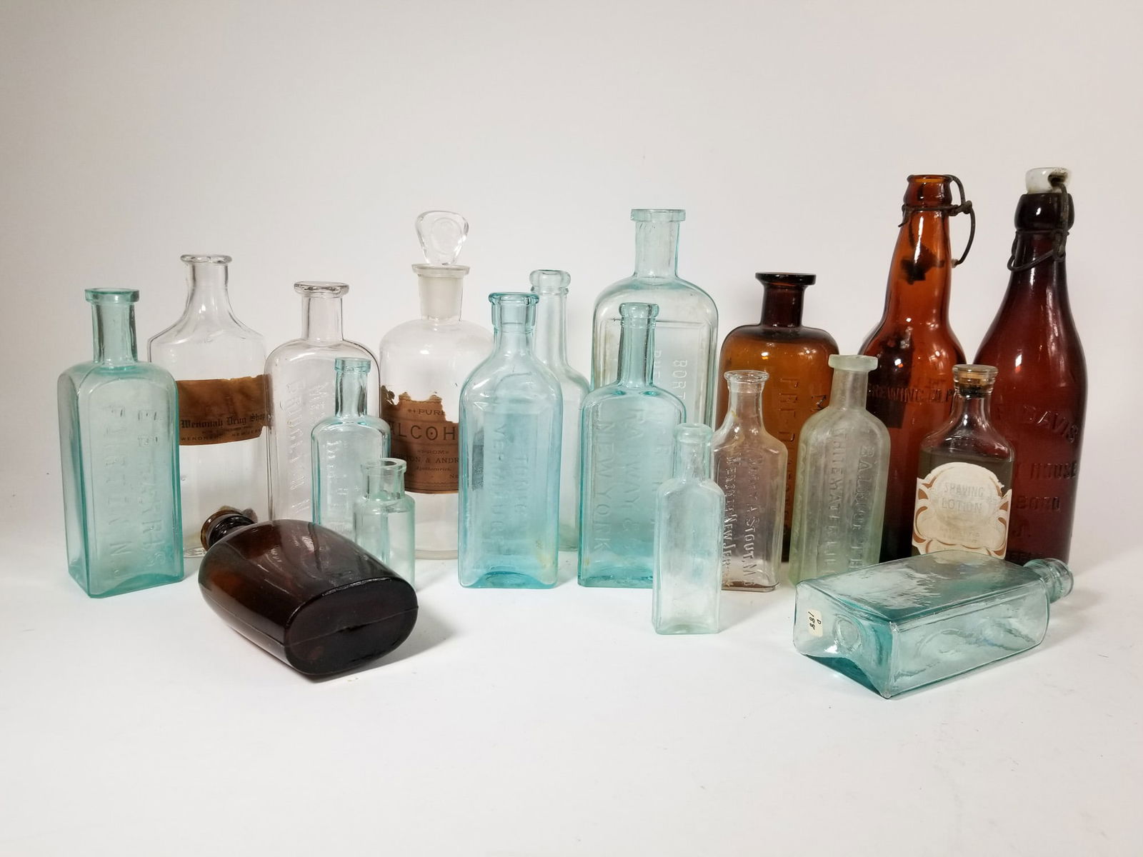 Antique Bottle Assortment ft. Local Bottles: Antique Bottle Assortment ft. Local BottlesSize7" x 12" x 12"LiteratureBrooks Auction – Online Auction Terms & Conditions Contact: (856) 694-2960 | info@brooks.auction READ BEFORE YOU BID: We