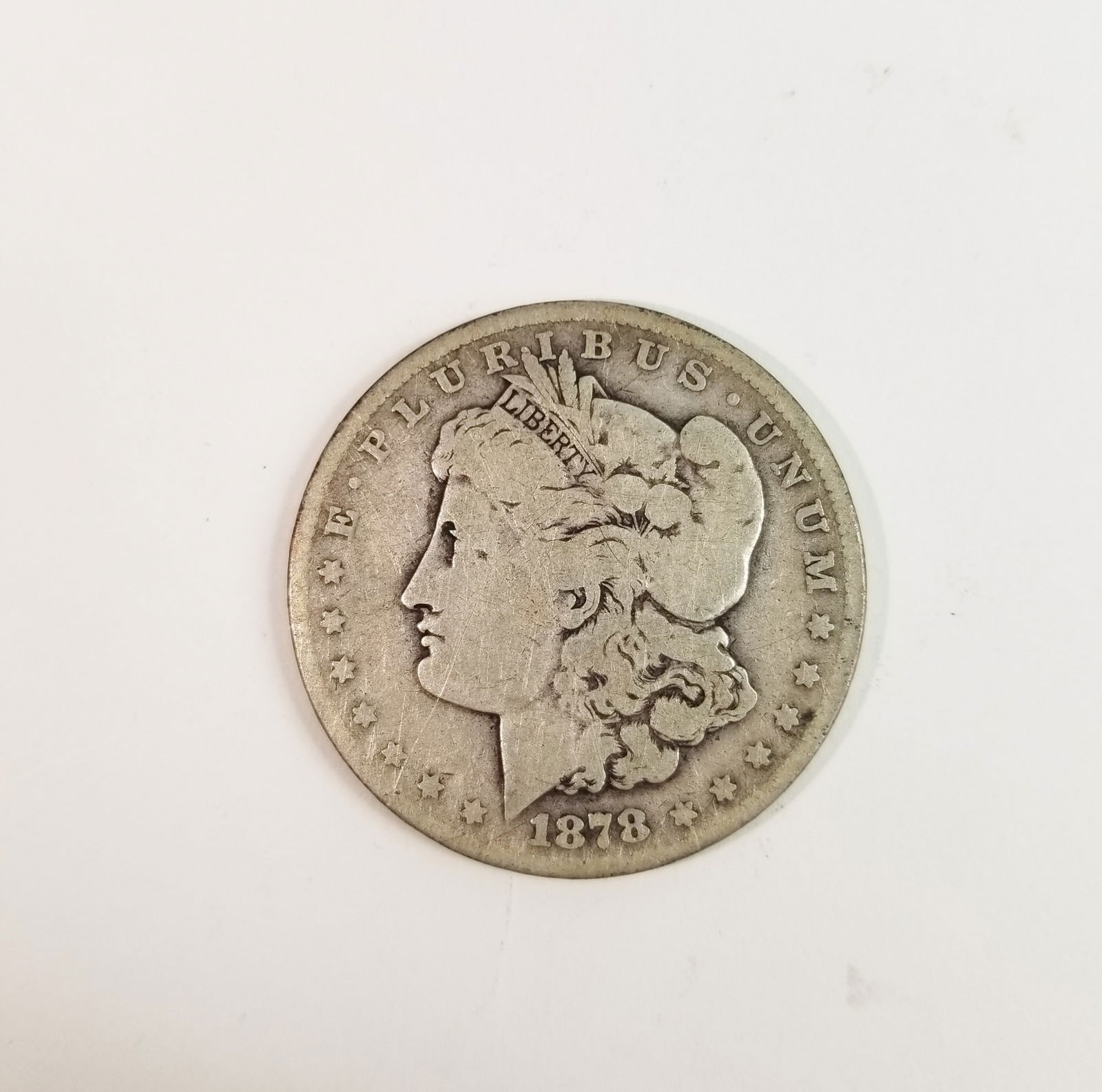 1878 Morgan Silver Dollar: 1878 MOrgan Dollar *P* 90% SilverLiteratureBrooks Auction – Online Auction Terms & Conditions Contact: (856) 694-2960 | info@brooks.auction READ BEFORE YOU BID: We want you to feel confident