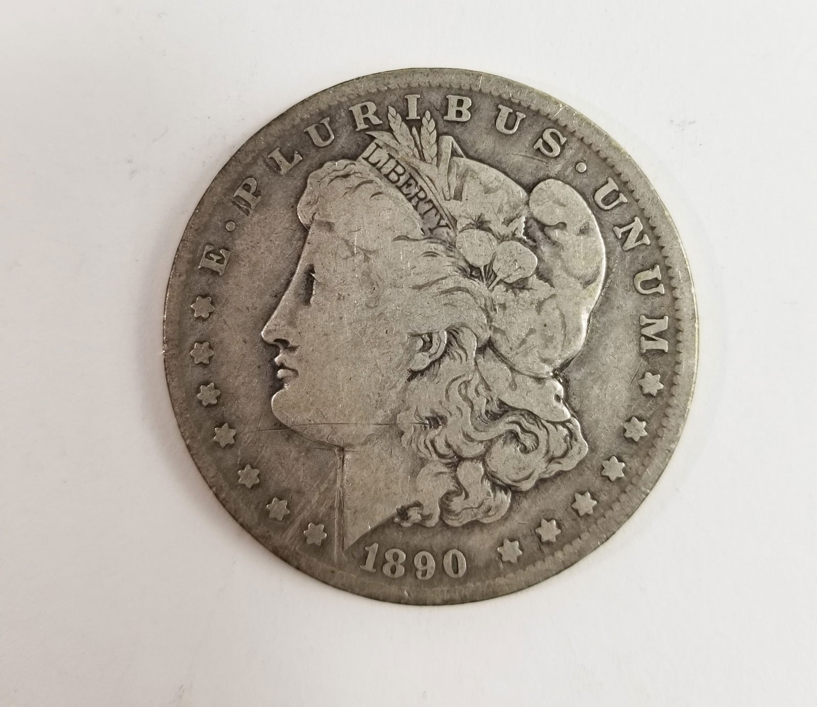1890 Morgan Silver Dollar: 1890 Morgan Dollar *O* 90% SilverLiteratureBrooks Auction – Online Auction Terms & Conditions Contact: (856) 694-2960 | info@brooks.auction READ BEFORE YOU BID: We want you to feel confident