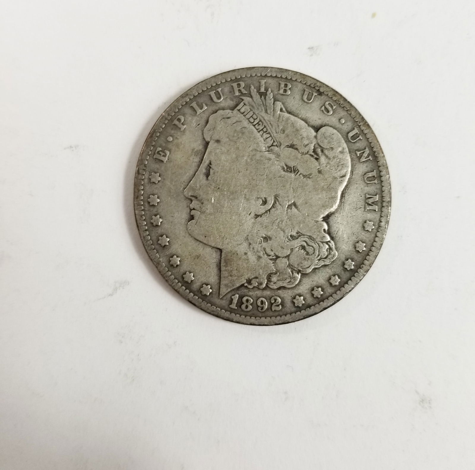 1892 Morgan Silver Dollar: 1892 Morgan Dollar *O* 90% SilverLiteratureBrooks Auction – Online Auction Terms & Conditions Contact: (856) 694-2960 | info@brooks.auction READ BEFORE YOU BID: We want you to feel confident