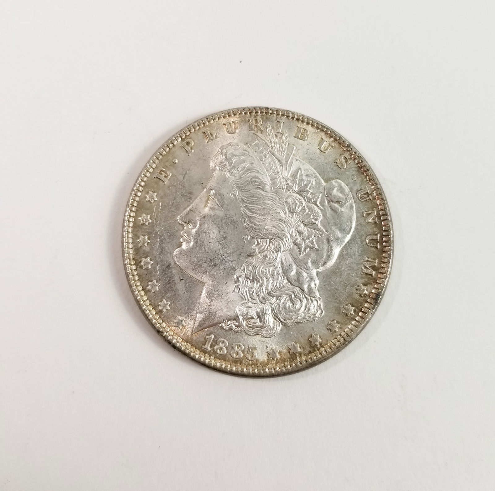 1885 Morgan Silver Dollar: 1885 Morgan Dollar *P* 90% SilverLiteratureBrooks Auction – Online Auction Terms & Conditions Contact: (856) 694-2960 | info@brooks.auction READ BEFORE YOU BID: We want you to feel confident