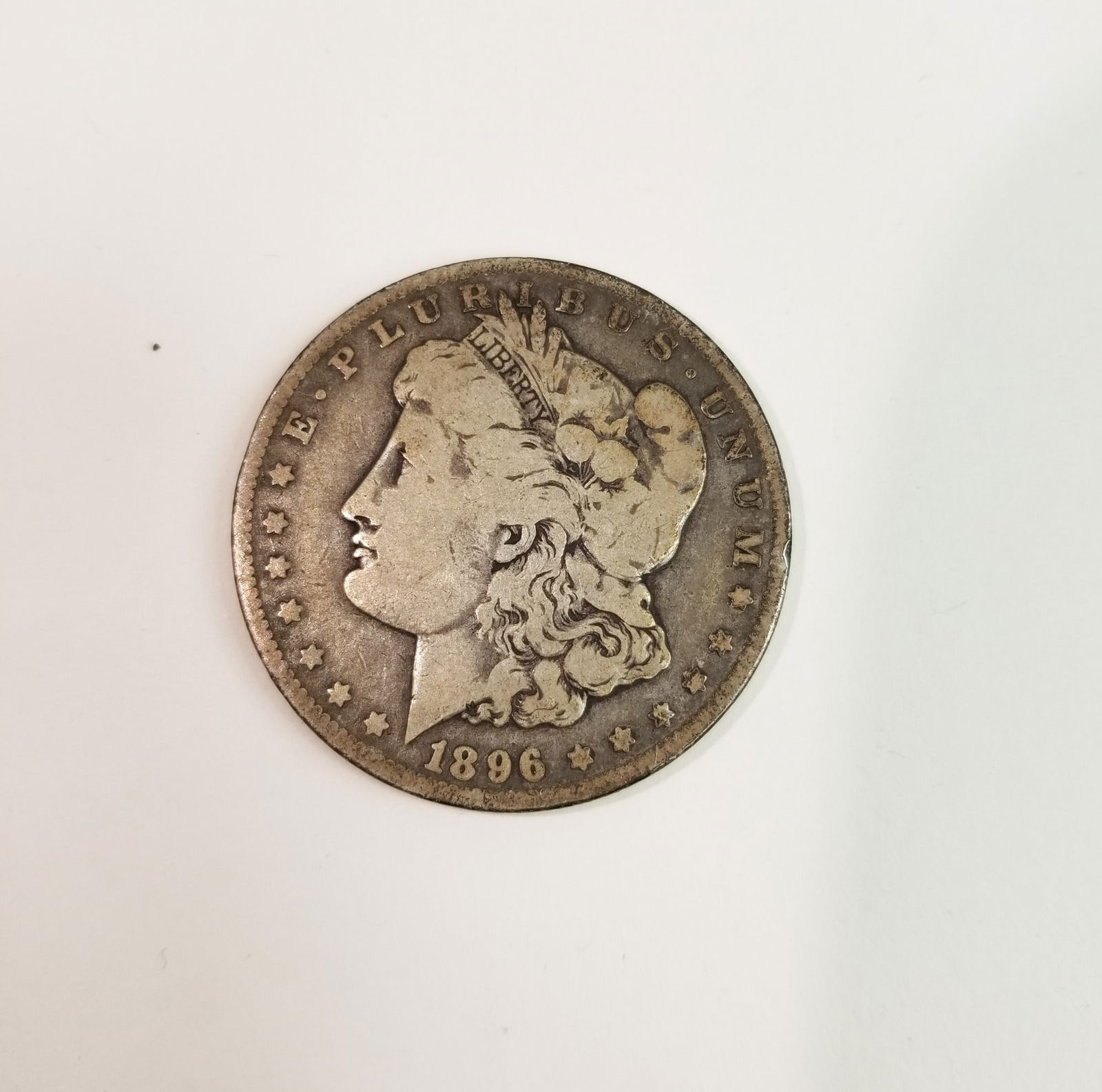 1896 Morgan Silver Dollar: 1896 Morgan Dollar *O* 90% SilverLiteratureBrooks Auction – Online Auction Terms & Conditions Contact: (856) 694-2960 | info@brooks.auction READ BEFORE YOU BID: We want you to feel confident