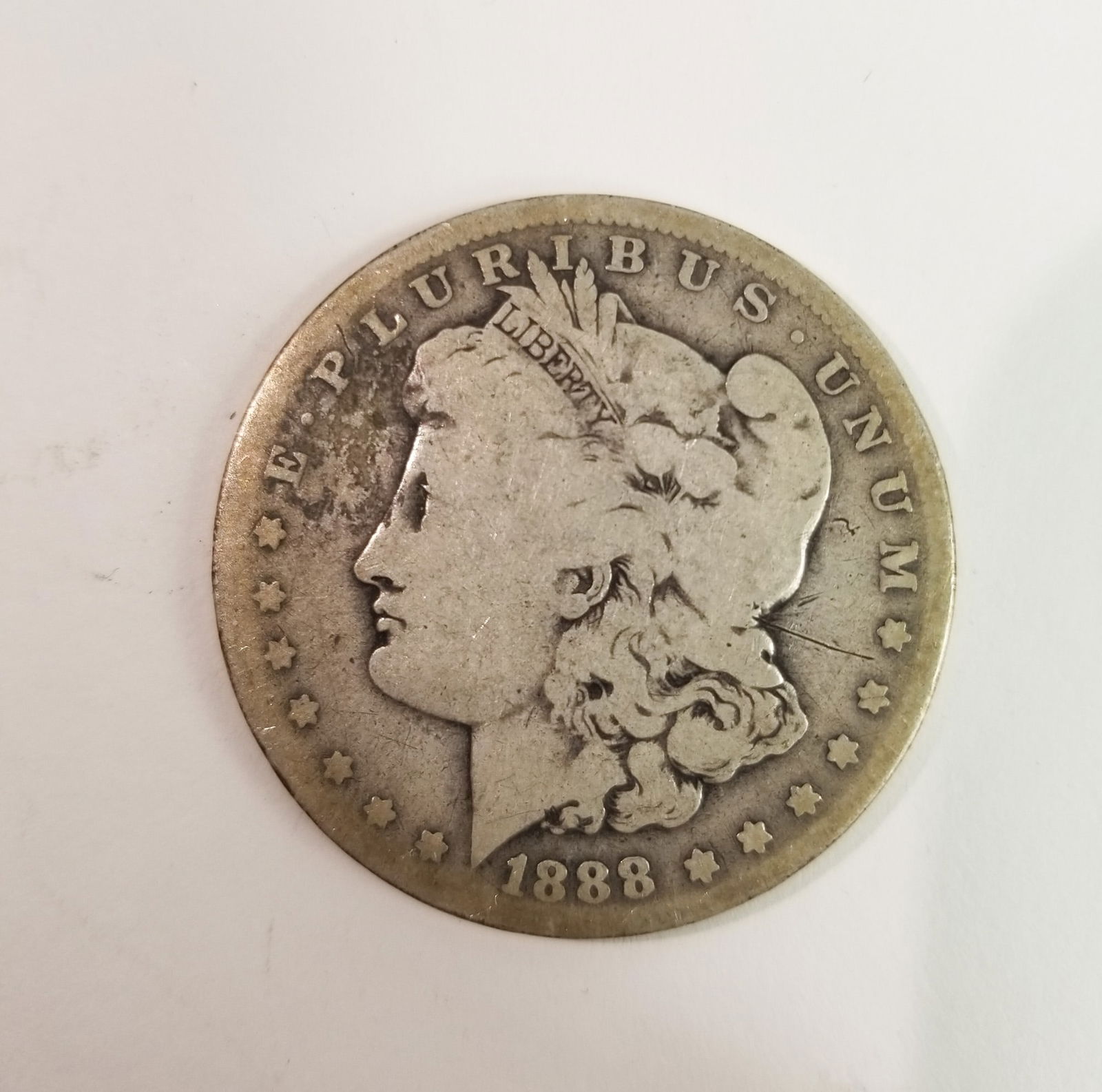 1888 Morgan Silver Dollar: 1888 Morgan Dollar *O* 90% SilverLiteratureBrooks Auction – Online Auction Terms & Conditions Contact: (856) 694-2960 | info@brooks.auction READ BEFORE YOU BID: We want you to feel confident