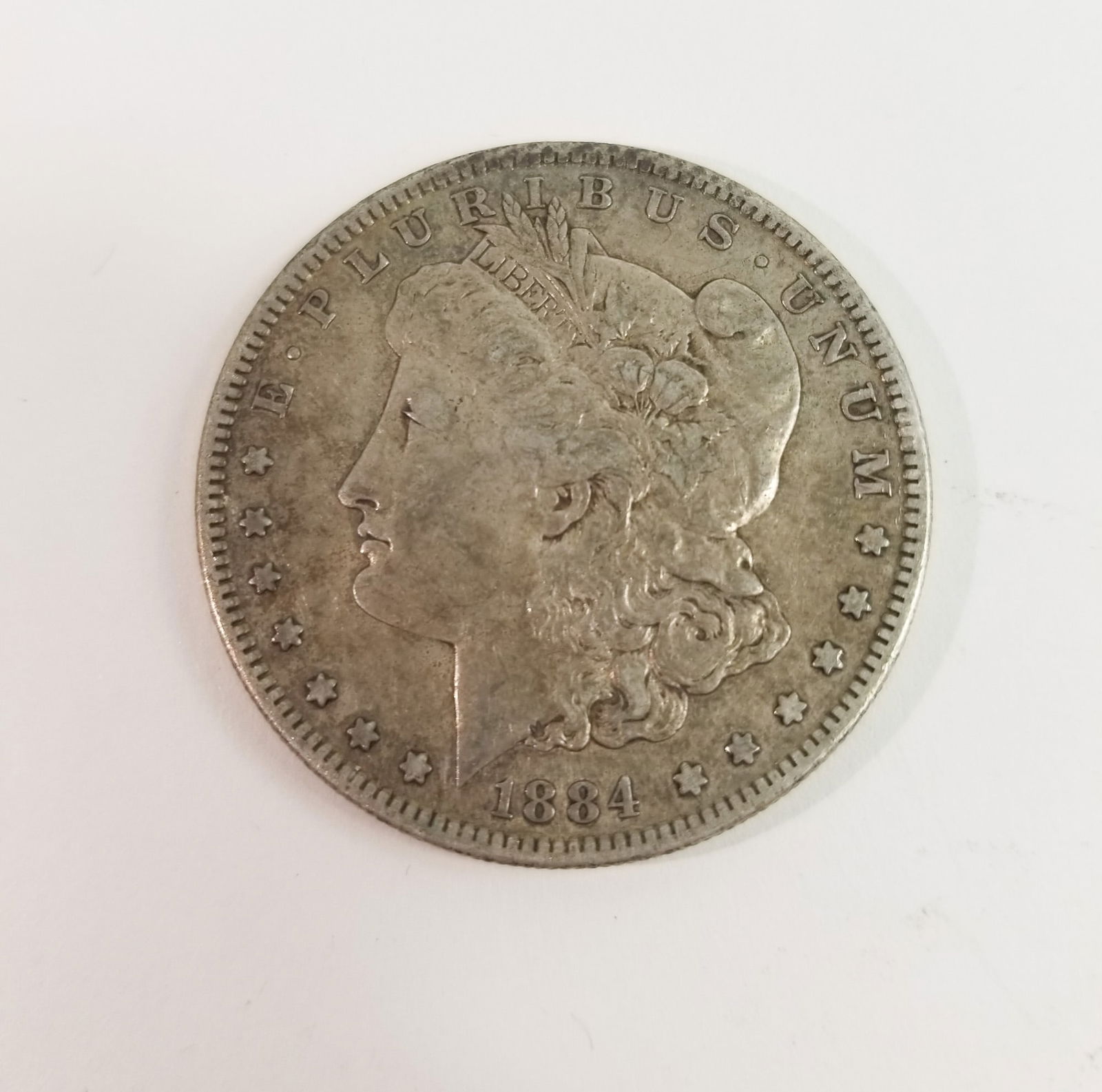 1884 Morgan Silver Dollar: 1884 Morgan Dollar *S* 90% SilverLiteratureBrooks Auction – Online Auction Terms & Conditions Contact: (856) 694-2960 | info@brooks.auction READ BEFORE YOU BID: We want you to feel confident