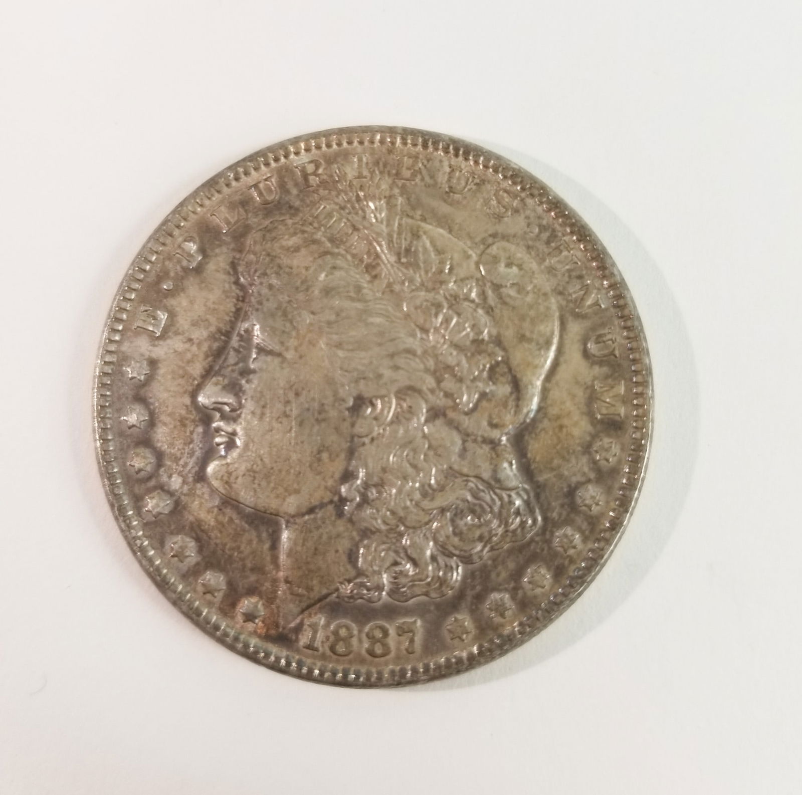 1887 Morgan Silver Dollar: 1887 Morgan Dollar *P* 90% SilverLiteratureBrooks Auction – Online Auction Terms & Conditions Contact: (856) 694-2960 | info@brooks.auction READ BEFORE YOU BID: We want you to feel confident