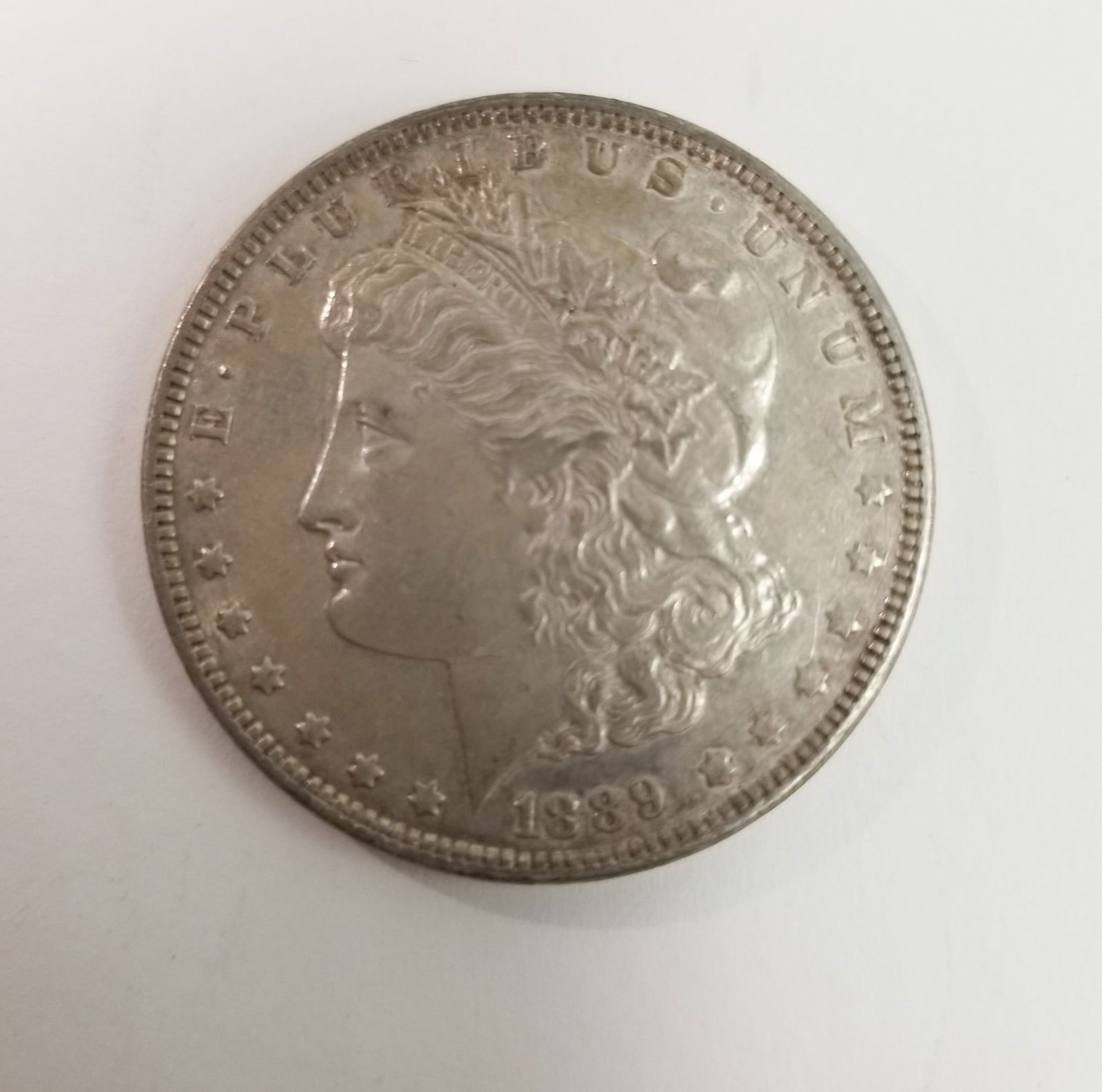 1889 Morgan Silver Dollar: 1889 Morgan Dollar *P* 90% SilverLiteratureBrooks Auction – Online Auction Terms & Conditions Contact: (856) 694-2960 | info@brooks.auction READ BEFORE YOU BID: We want you to feel confident