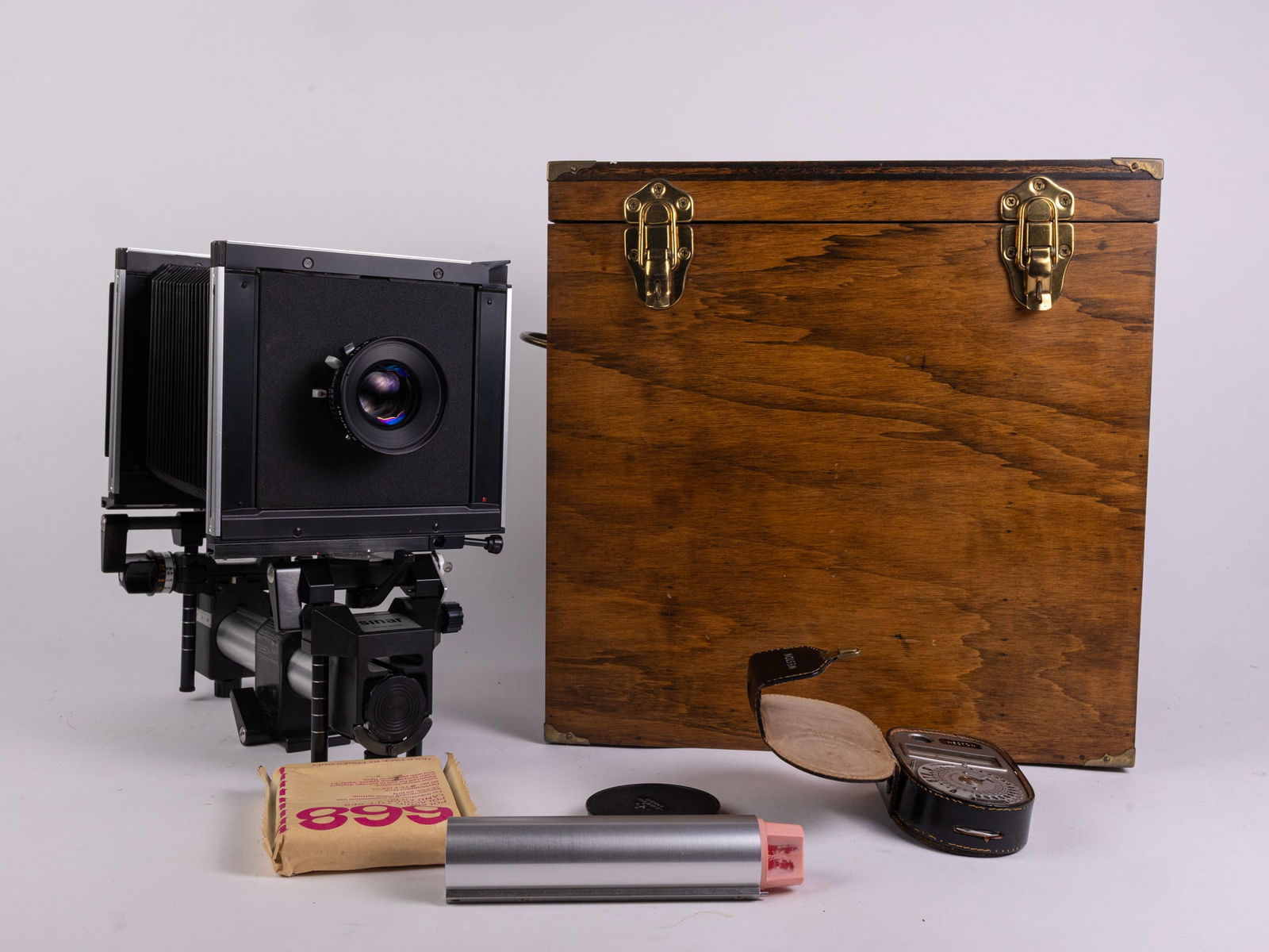 Sinar F 4x5 w/ 150mm Rodenstock Sironar F/5.6 Lens w/ Accessories: Sinar F 4x5 w/ 150mm Rodenstock Sironar F/5.6 Lens w/ Accessories. This camera is in overall good shape. The lens is in good shape as well and the shutter fires. The camera was not tested with