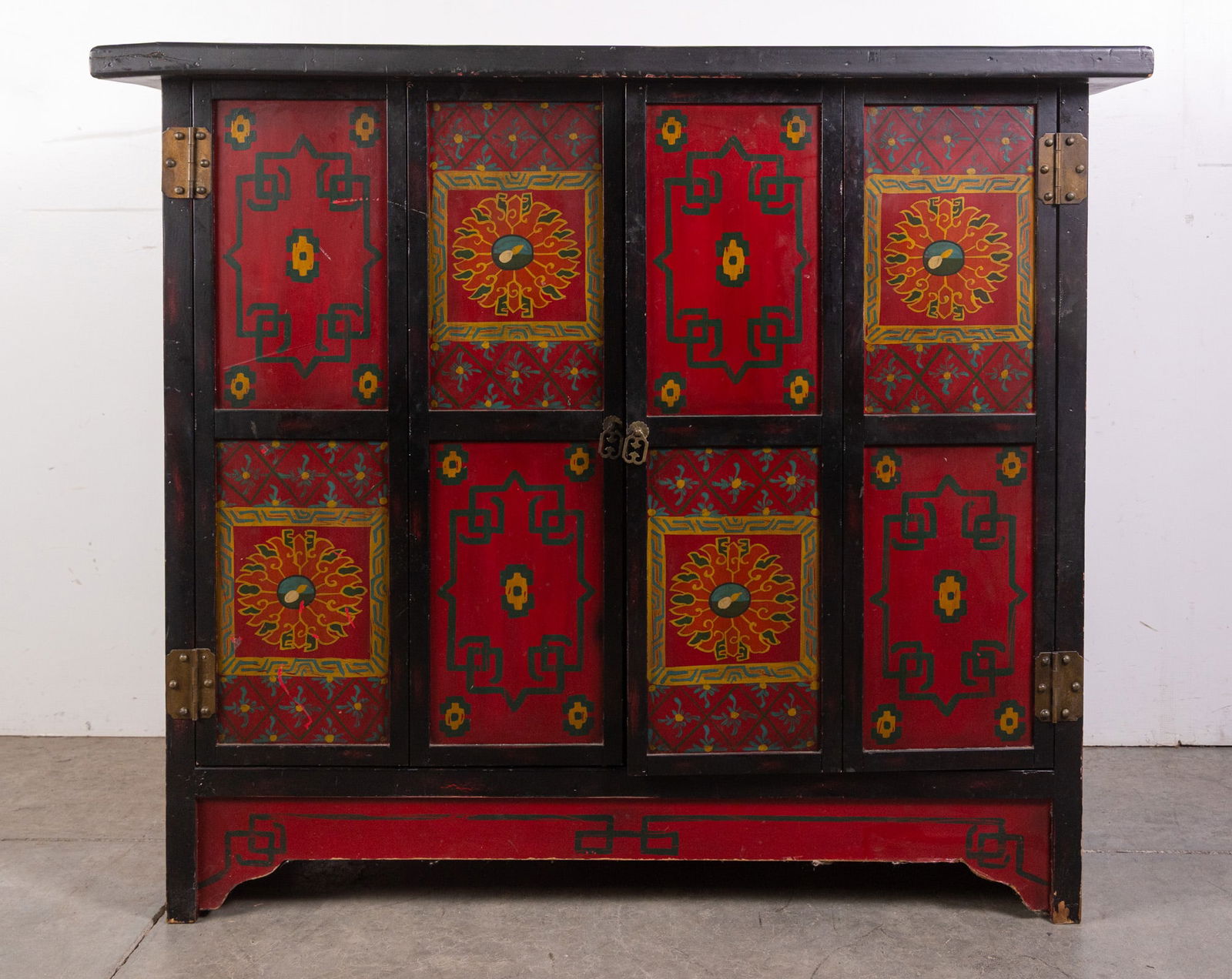 Hand Painted Asian Style Sideboard Cabinet: Hand Painted Asian Style Sideboard Cabinet, Really beautiful cabinet painted with deep red, green, and yellow geometric designs done in an Asian style.Size38" x 44" x 20"LiteratureBrooks Auction