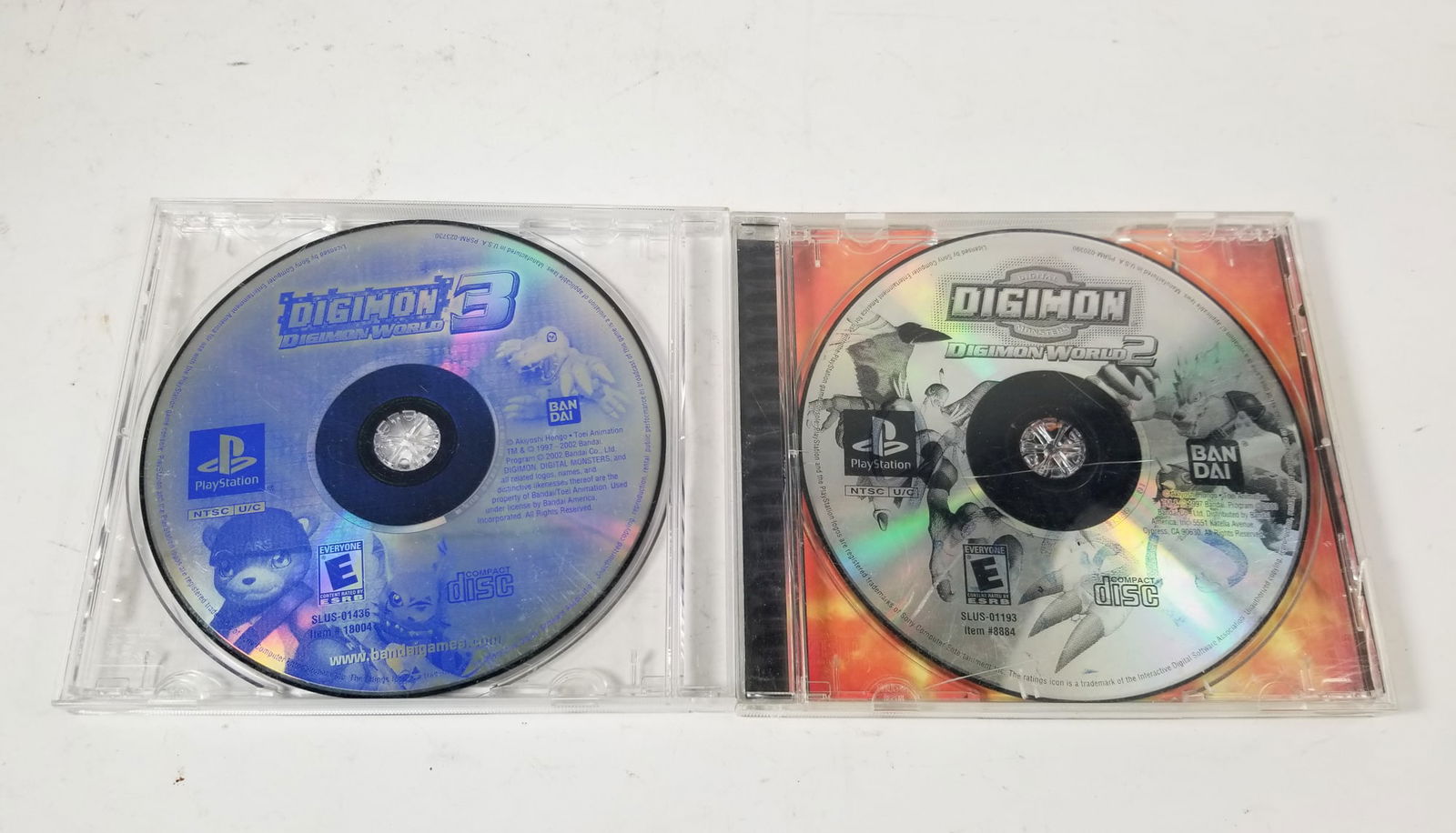 Two Digimon PlayStation Games: Two Digimon PlayStation Games: Lot includes Digimon: Digimon World 2 in original case, but case is missing front cover, as well as Digimon 3 (dsc only)Size5" x 5.5"LiteratureBrooks Auction –