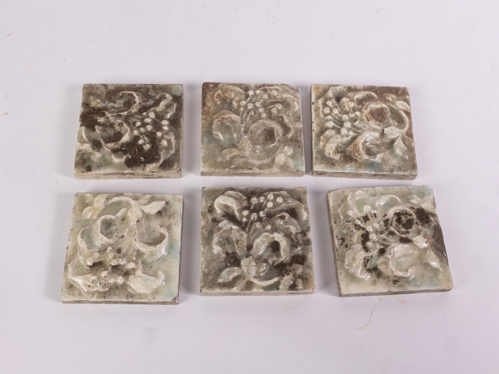 Six Vintage Architectural Salvage Ceramic Tiles with Lily Design: Six Vintage Architectural Salvage Ceramic Tiles with Lily DesignSize3" x 3"LiteratureBrooks Auction – Online Auction Terms & Conditions Contact: (856) 694-2960 | info@brooks.auction READ BEFORE