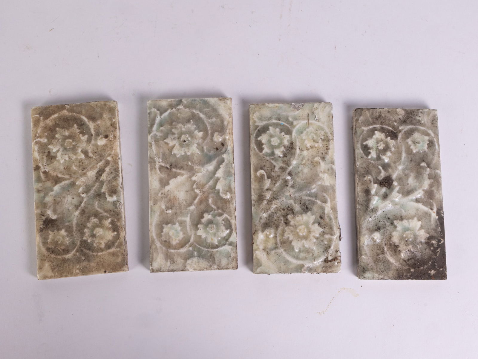 Four Floral Vine Motif Vintage Architectural Salvage Ceramic Tiles: Four Floral Vine Motif Vintage Architectural Salvage Ceramic TilesSize3" x 6"LiteratureBrooks Auction – Online Auction Terms & Conditions Contact: (856) 694-2960 | info@brooks.auction READ