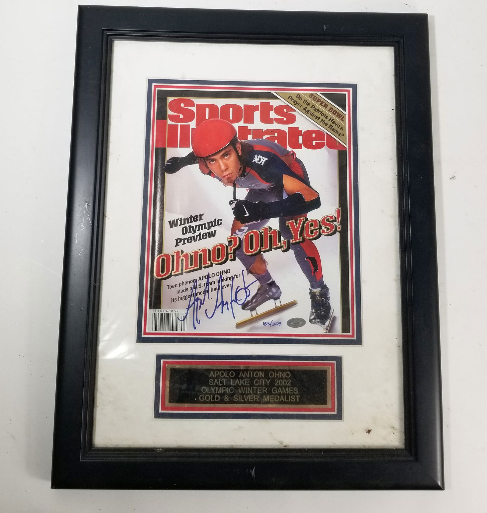 Framed Sports Illustrated with Apolo Ohno Autograph: Framed Sports Illustrated with Apolo Ohno Autograph, 2002 Salt Lake City Winter Olympics preview edition of Sports Illustrated with Apolo Ohno on the cover with autograph near lower left, and