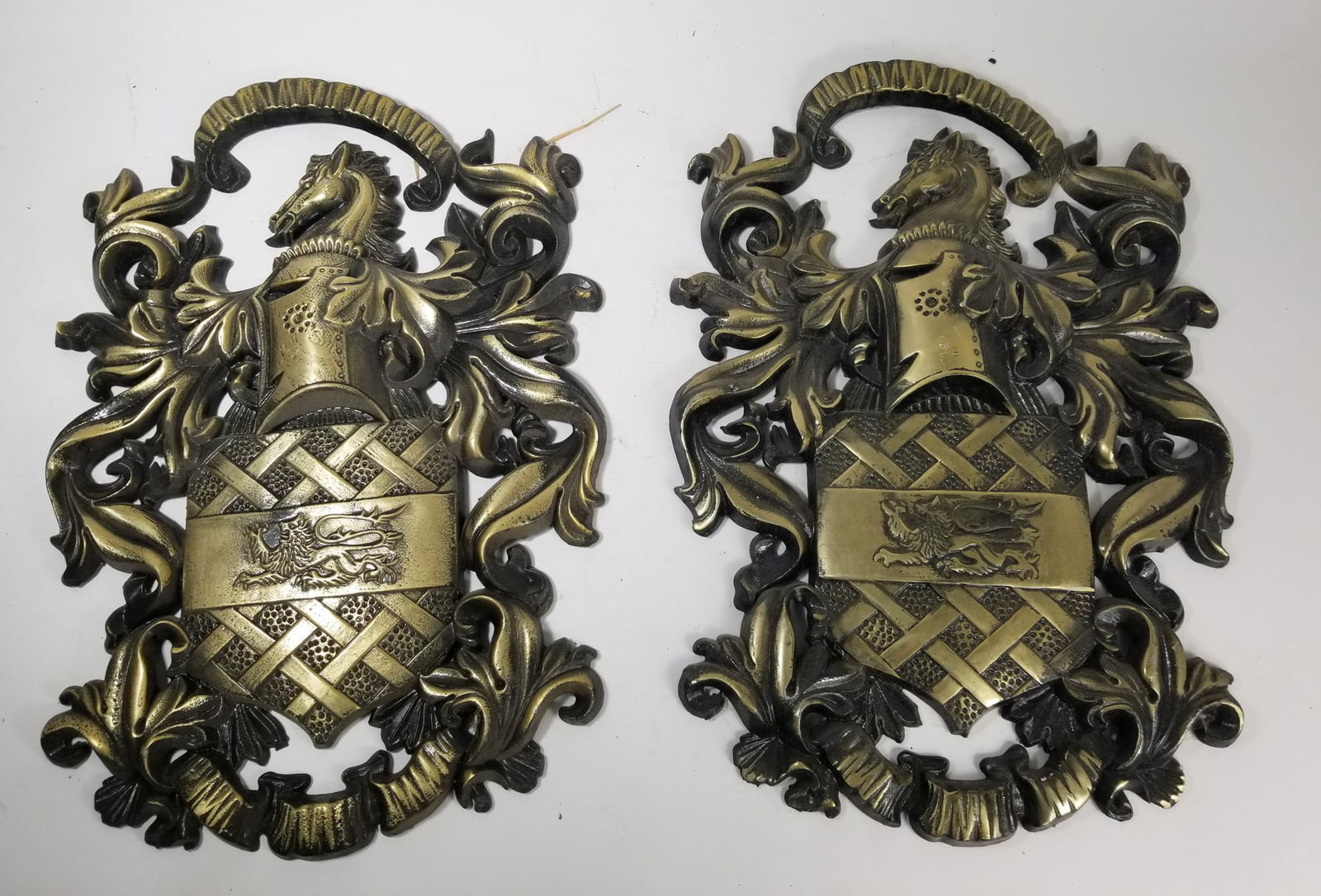 Pair of Medieval Style Coat of Arms Wall Mounted Metal Plaques: Pair of Medieval Style Coat of Arms Wall Mounted Metal PlaquesSize20" HLiteratureBrooks Auction – Online Auction Terms & Conditions Contact: (856) 694-2960 | info@brooks.auction READ BEFORE YOU