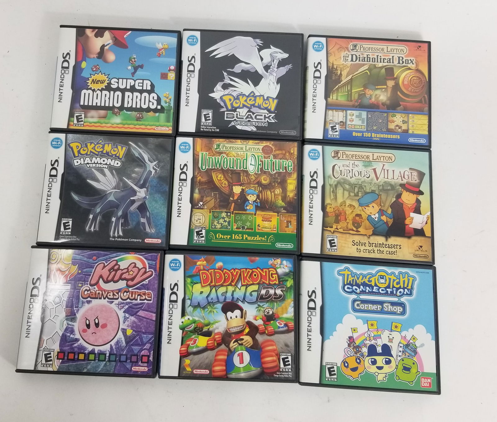 Lot of Assorted Nintendo DS Empty Game Cases: Lot of Assorted Nintendo DS Empty Game Cases: Pokemon Black - Pokemon Diamond - Super Mario Bros. - Kirby Canvas Curse - and more Size 7" x 12" x 12" Literature Brooks Auction – Online Auction T