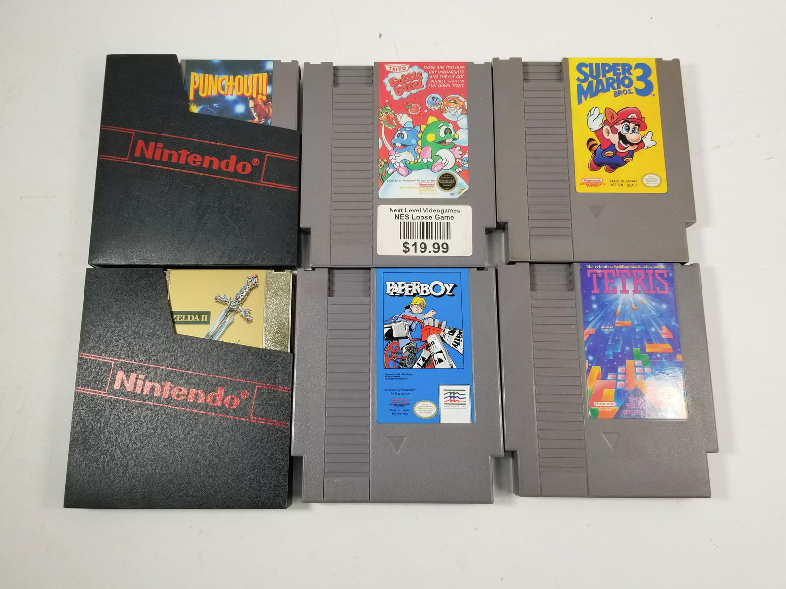 Assorted NES Nintendo Entertainment System Games: Assorted NES Nintendo Entertainment System Games: Paperboy - Bubble Bubble - Tetris - Zelda II - Super Mario Bros 3 - Punch Out Size 7" x 12" x 12" Literature Brooks Auction – Online Auction Ter