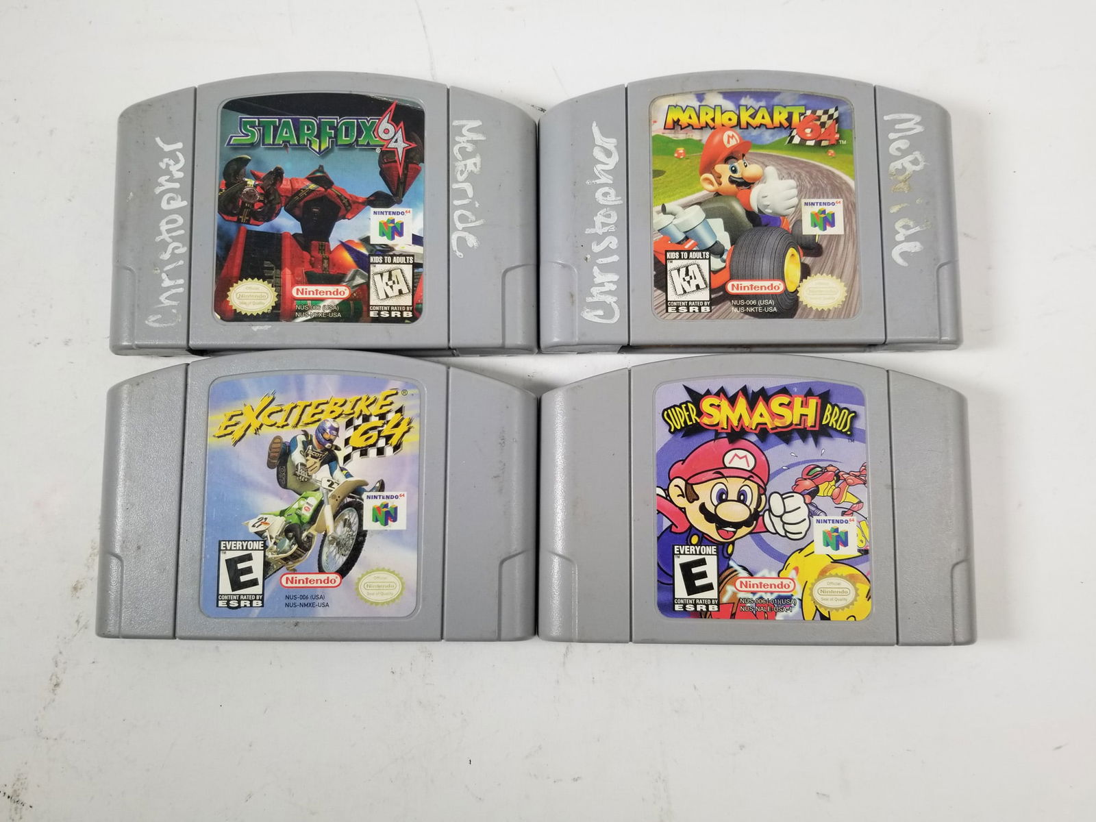 Four Nintendo 64 N64 Games: Four Nintendo 64 N64 Games: Super Smash Bros - Star Fox 64 - Mario Kart 64 - Excitebike 64Size7" x 12" x 12"LiteratureBrooks Auction – Online Auction Terms & Conditions Contact: (856) 694-2960