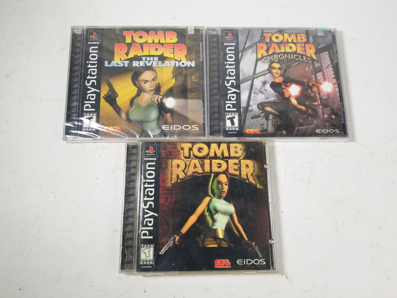Three PS1 PlayStation Tomb Raider Games Including Factory Sealed: Three PS1 PlayStation Tomb Raider Games Including Factory Sealed Size 7" x 12" x 12" Literature Brooks Auction – Online Auction Terms & Conditions Contact: (856) 694-2960 | info@brooks.auction