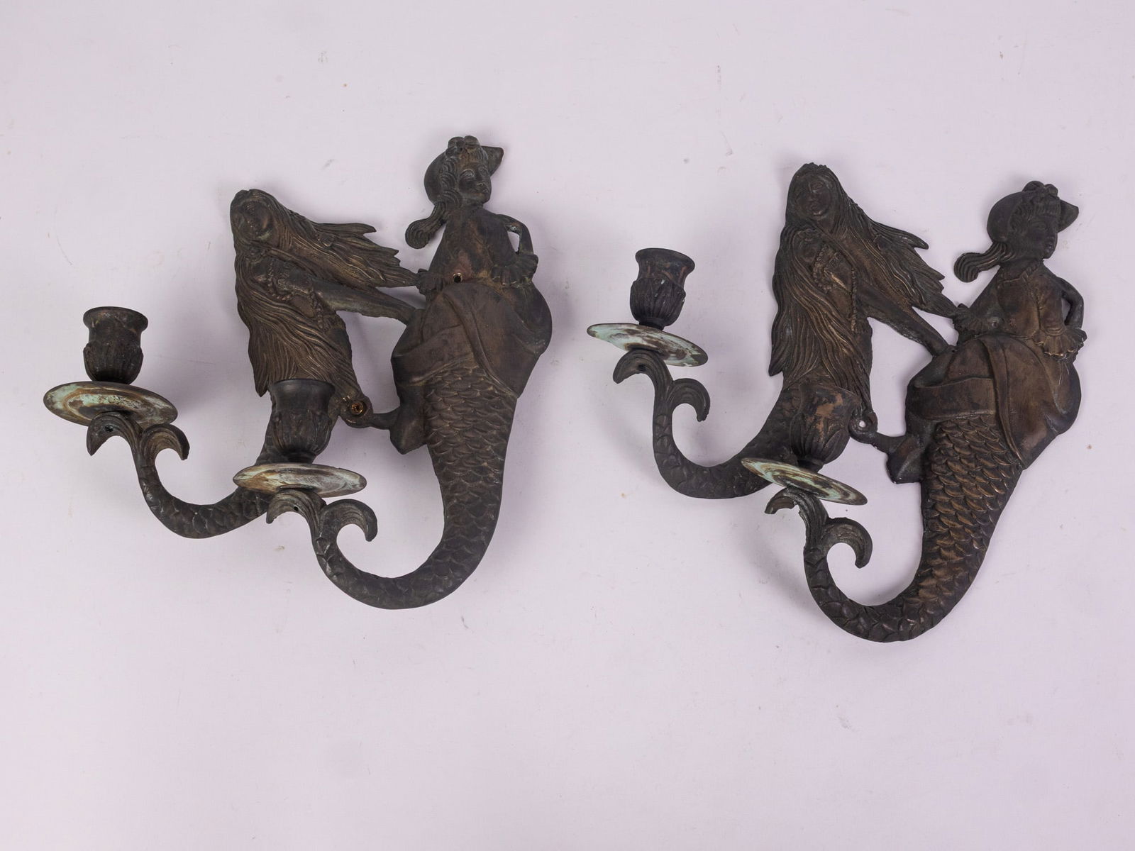 Pair of Vintage Wall Mounted Cast Metal Mermaid Sconces: Pair of Vintage Wall Mounted Cast Metal Mermaid SconcesSize11" HLiteratureBrooks Auction – Online Auction Terms & Conditions Contact: (856) 694-2960 | info@brooks.auction READ BEFORE YOU BID: