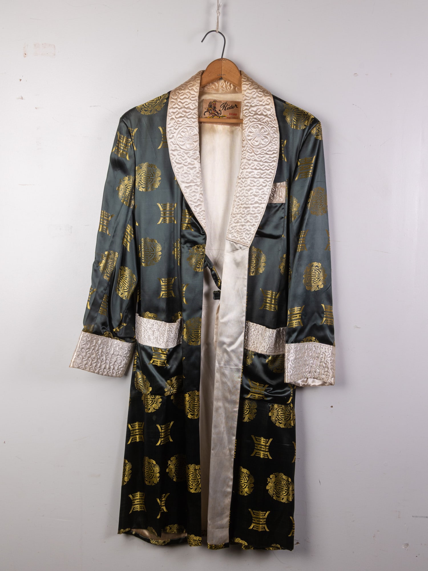 Vintage Satin Mens Dressing Gown by Rider w/ Quilted Collar & Gold Jacquard Pattern: Vintage Satin Mens Dressing Gown by Rider w/ Quilted Collar & Gold Jacquard PatternLiteratureBrooks Auction – Online Auction Terms & Conditions Contact: (856) 694-2960 | info@brooks.auction