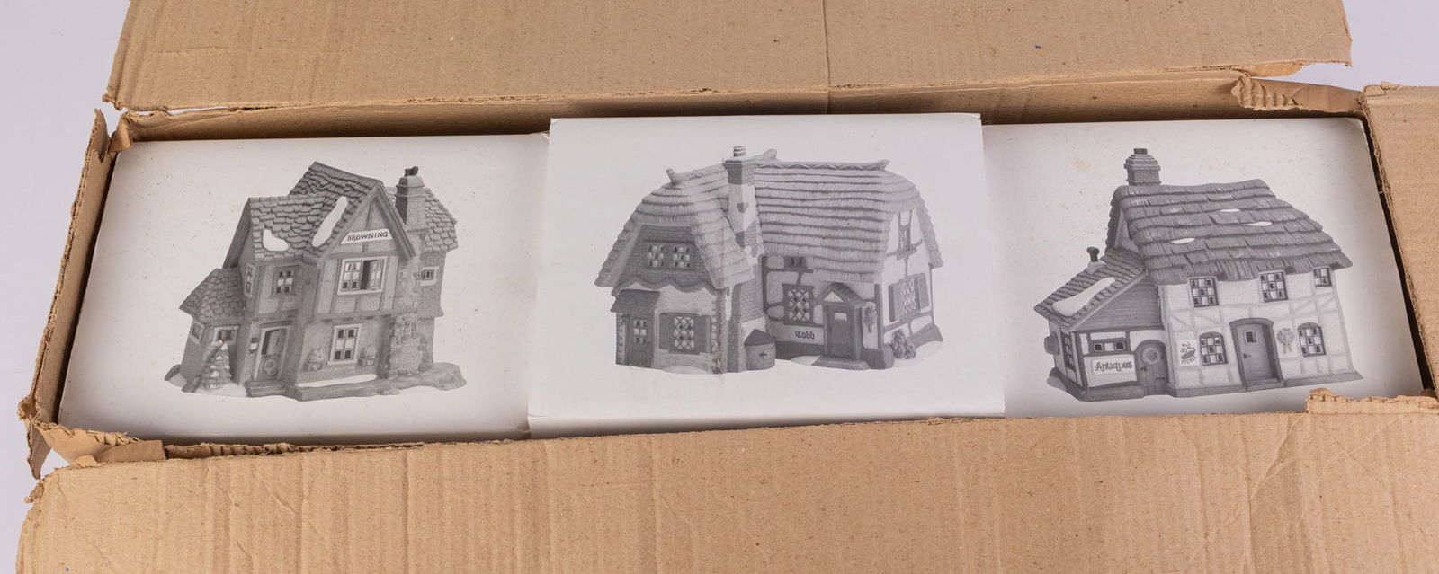Three Department 56 Christmas Village Cottages IOB: Three Department 56 Christmas Village Cottages IOB: Mr. and Mrs. Pickle - Cobb Cottage - Browning CottageSize7" x 30" x 10"LiteratureBrooks Auction – Online Auction Terms & Conditions Contact: