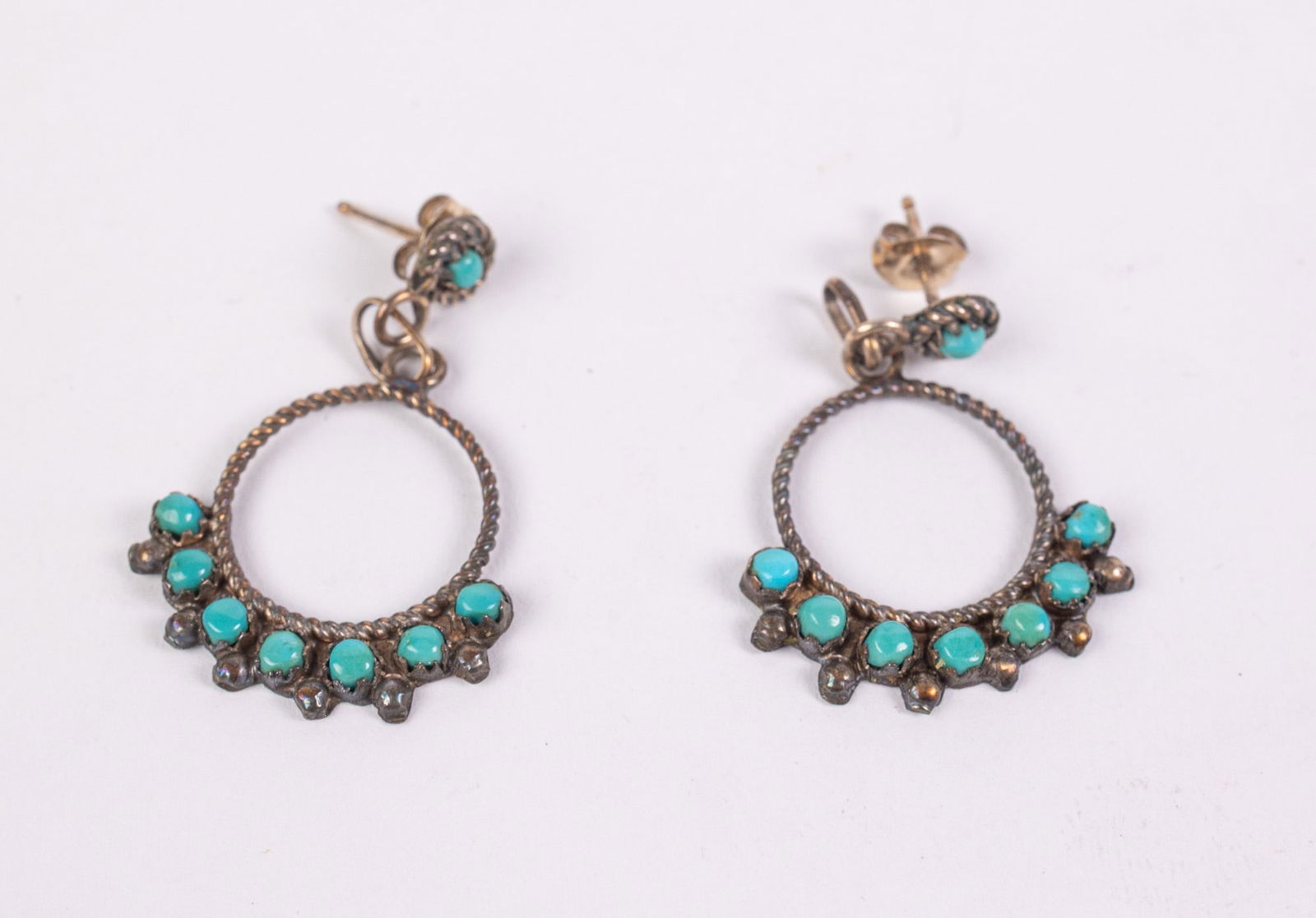 Zuni Sterling silver and snake eye turquoise Earrings: Zuni Sterling silver and snake eye turquoise EarringsLiteratureBrooks Auction – Online Auction Terms & Conditions Contact: (856) 694-2960 | info@brooks.auction READ BEFORE YOU BID: We want you