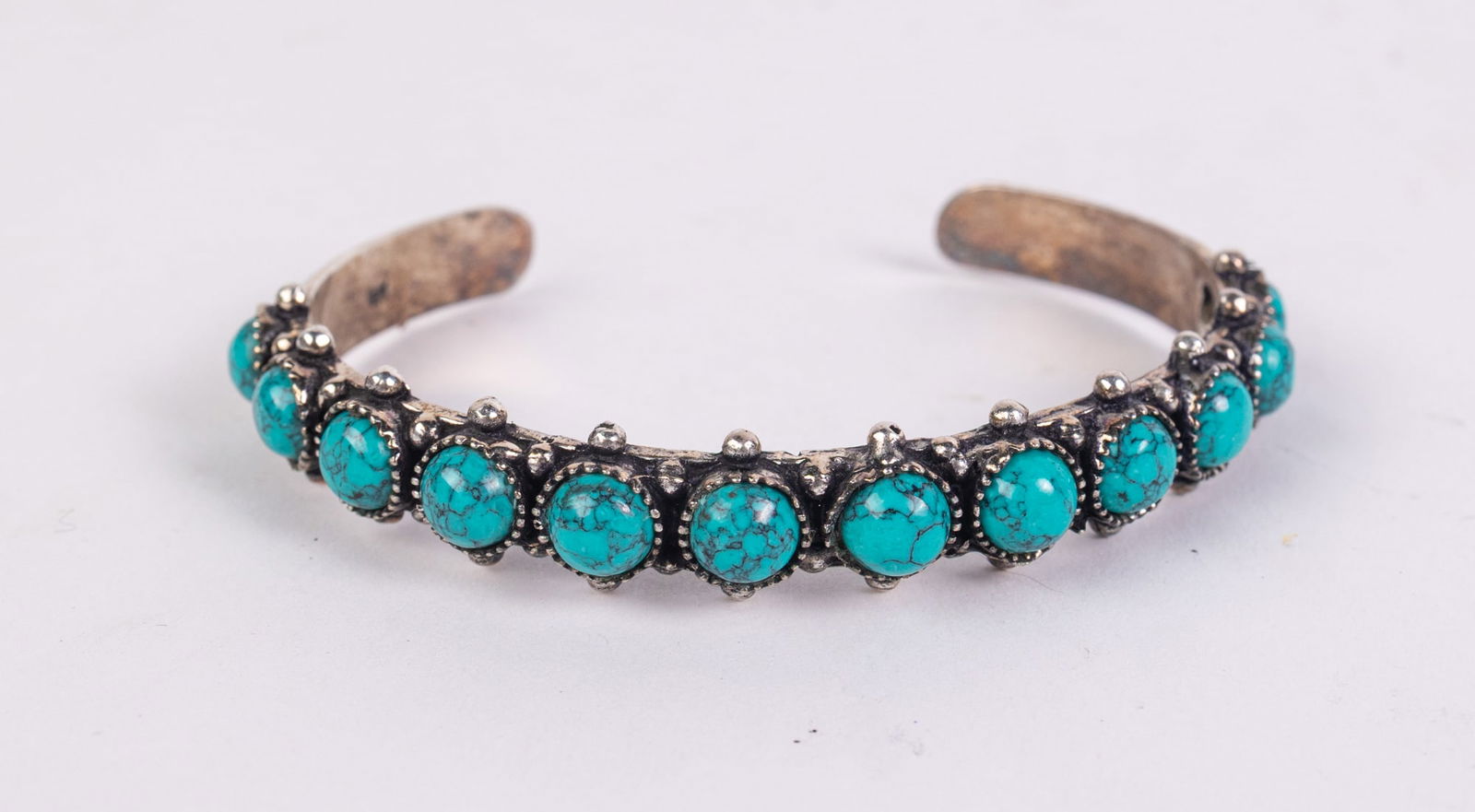 VIntage Zuni Sterling Silver and turquoise Cuff: VIntage Zuni Sterling Silver and turquoise CuffLiteratureBrooks Auction – Online Auction Terms & Conditions Contact: (856) 694-2960 | info@brooks.auction READ BEFORE YOU BID: We want you to