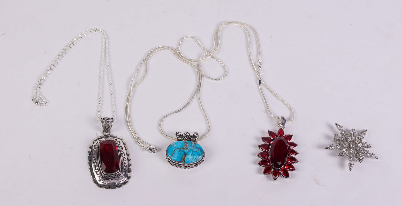 Lot of 3 Pendant necklace stamped 925 and a Pin: Lot of 3 Pendant necklace stamped 925 and a PinLiteratureBrooks Auction – Online Auction Terms & Conditions Contact: (856) 694-2960 | info@brooks.auction READ BEFORE YOU BID: We want you to