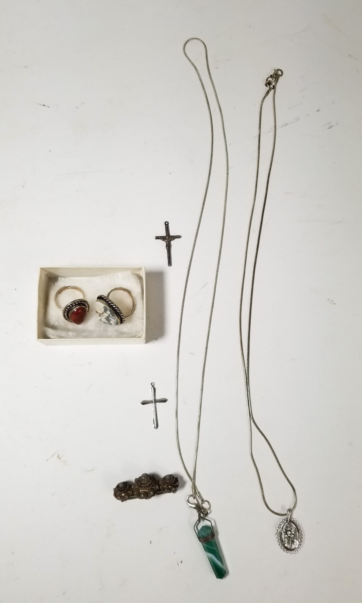 Sterling silver jewelry lot: 2xRings, 2xNecklaces, 2xcross Pendants, 1xPinLiteratureBrooks Auction – Online Auction Terms & Conditions Contact: (856) 694-2960 | info@brooks.auction READ BEFORE YOU BID: We want you to feel