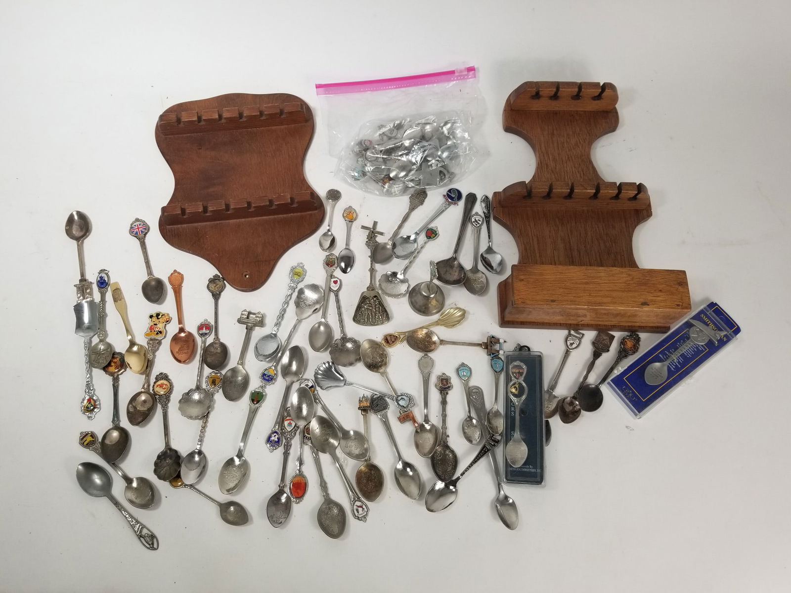 Large Assortment of Collector spoons with two holders: Large Assortment of Collector spoons with two holders Literature Brooks Auction – Online Auction Terms & Conditions Contact: (856) 694-2960 | info@brooks.auction READ BEFORE YOU BID: We want you