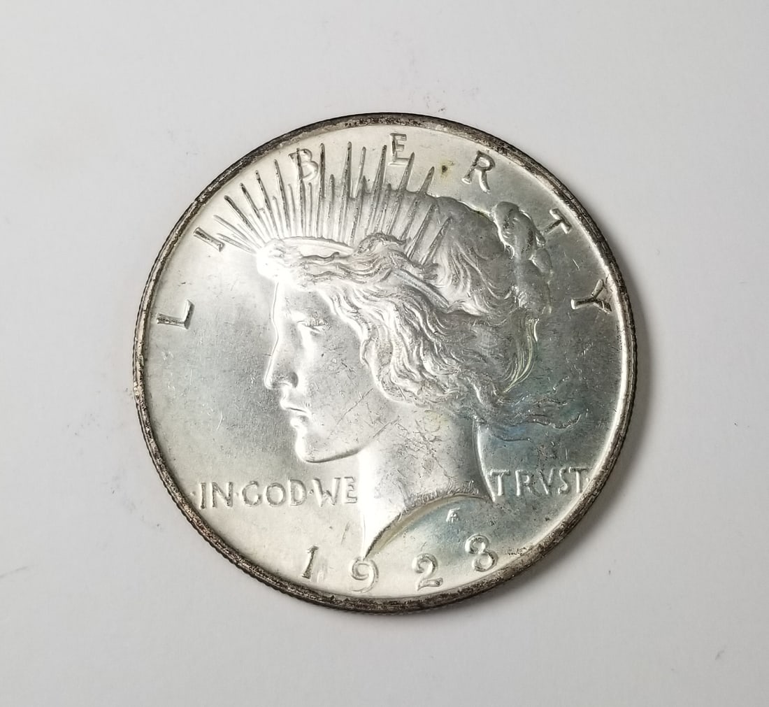 1928 US Silver Peace Dollar: 1928 Peace Silver Dollar Philadelphia Mint Literature Brooks Auction – Online Auction Terms & Conditions Contact: (856) 694-2960 | info@brooks.auction READ BEFORE YOU BID: We want you to feel co