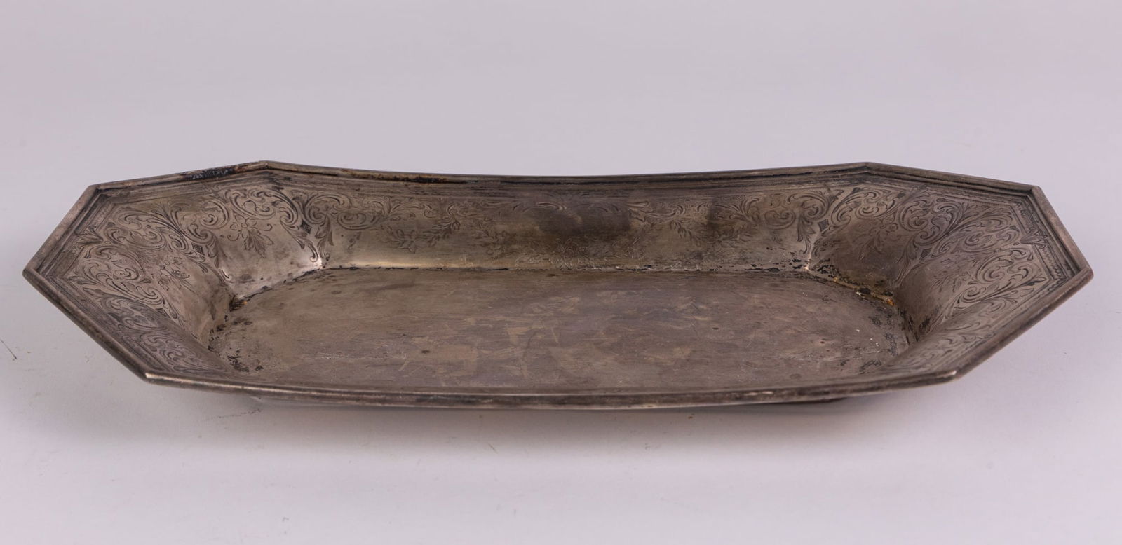 J.E. Caldwell & Co | Hand Etched Octagonal Sterling Silver Tray: Marked "J.E. Caldwell & Co 925 Sterling 1000 Philadelphia 4T". The total weight: 360.4 gramsLiteratureBrooks Auction – Online Auction Terms & Conditions Contact: (856) 694-2960 |