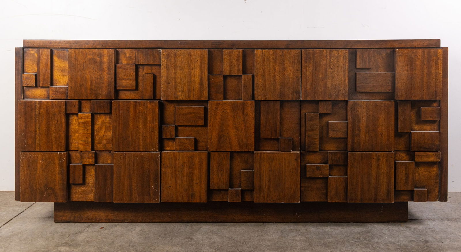 Lane | "Staccato" Brutalist Low Chest w/ Mirror: The Lane “Staccato” line is a striking example of mid‑century American design, marking a bold shift for Lane Furniture with its sculptural, Brutalist-inspired forms. Launched in the