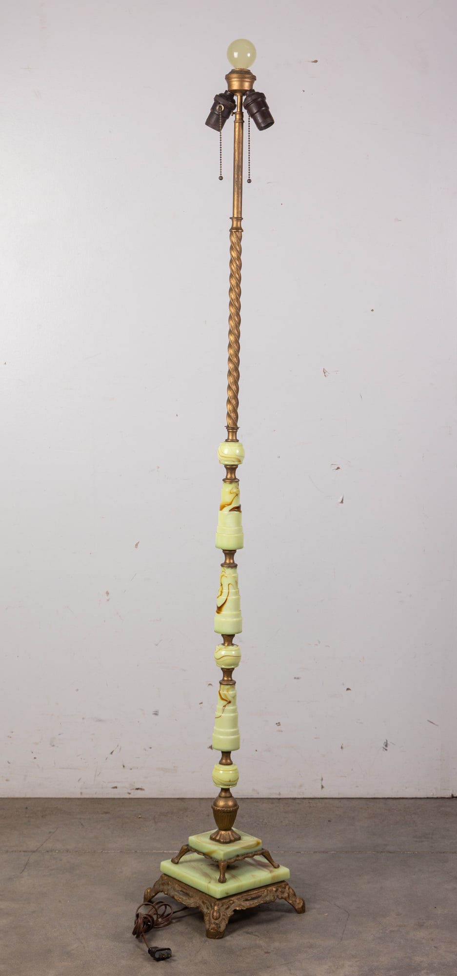 Art Deco Uranium Slag Glass Floor Lamp: This classic, elegant art deco floor lamp is constructed from gold toned metal and features a wealth of uranium slag glass embellishment, including a huge uranium glass spherical finial. It has been t