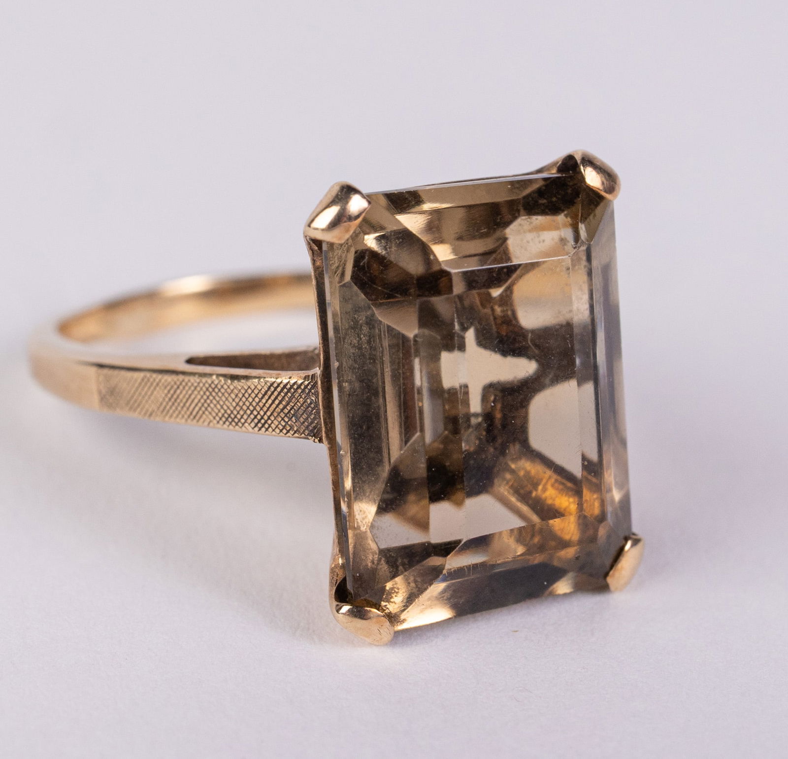 14KY Gold Smoky Quartz Emerald Cut Ring: size 10, total weight 5.91 grams. No visible markingsLiteratureBrooks Auction – Online Auction Terms & Conditions Contact: (856) 694-2960 | info@brooks.auction READ BEFORE YOU BID: We want you