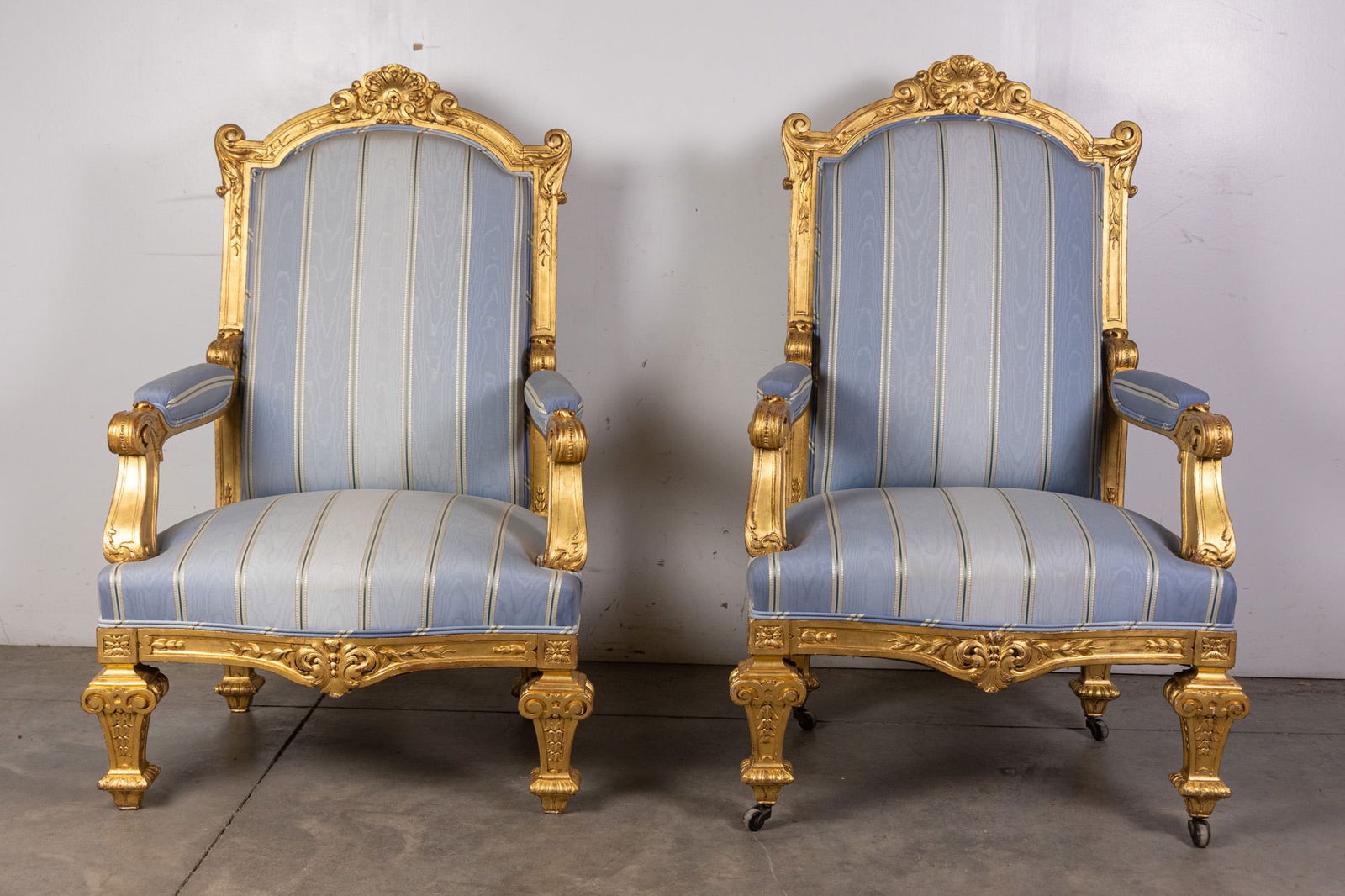 Louis XVI Style Gold Gilt Frame Chairs: A refined pair of Louis XVI style chairs featuring elegantly carved gold gilt frames with neoclassical detailing. Upholstered seats and backs provide comfort while complementing the ornate woodwork,