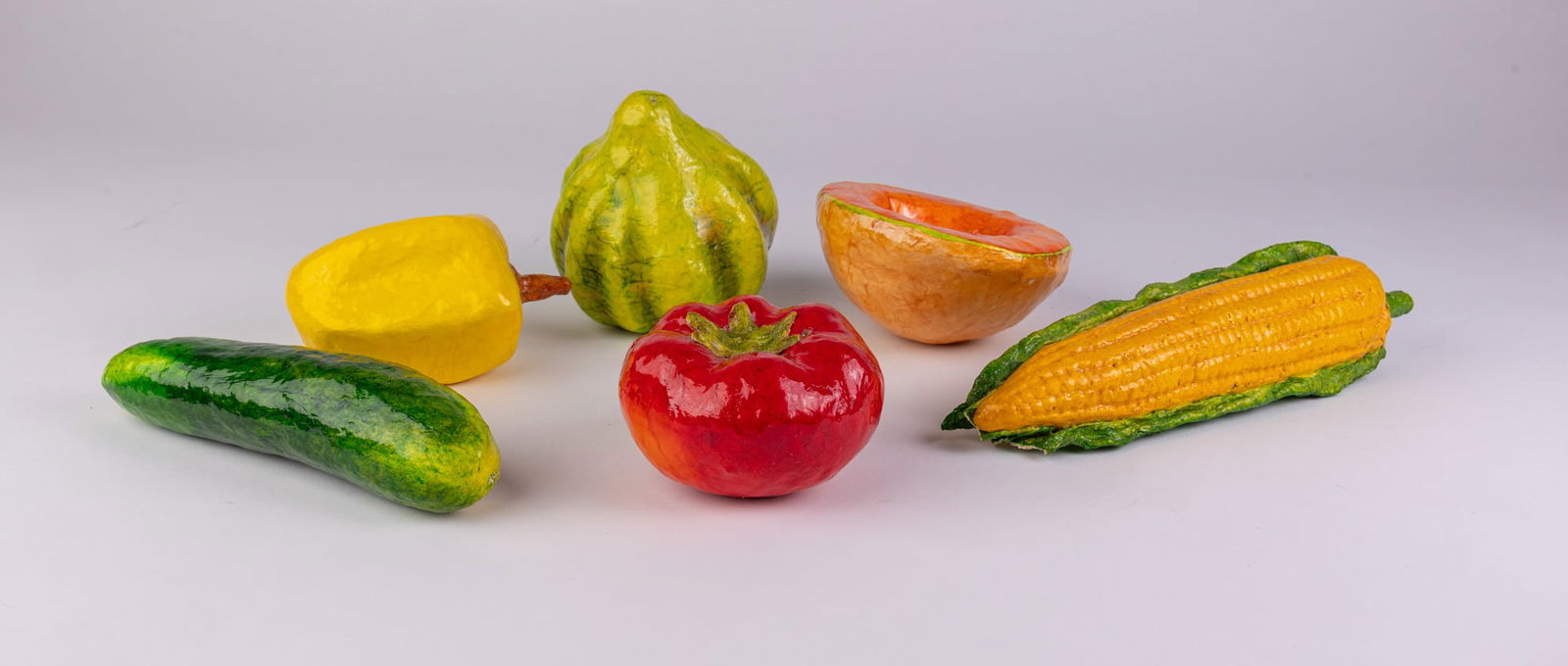 Six Folk Art Papier-Mâché Fruits and Vegetable Sculptures: From the artist's website, "Robert Kipniss is a distinguished American painter and printmaker. His work has been shown in solo exhibitions at galleries and museums worldwide since 1951. He is a Royal