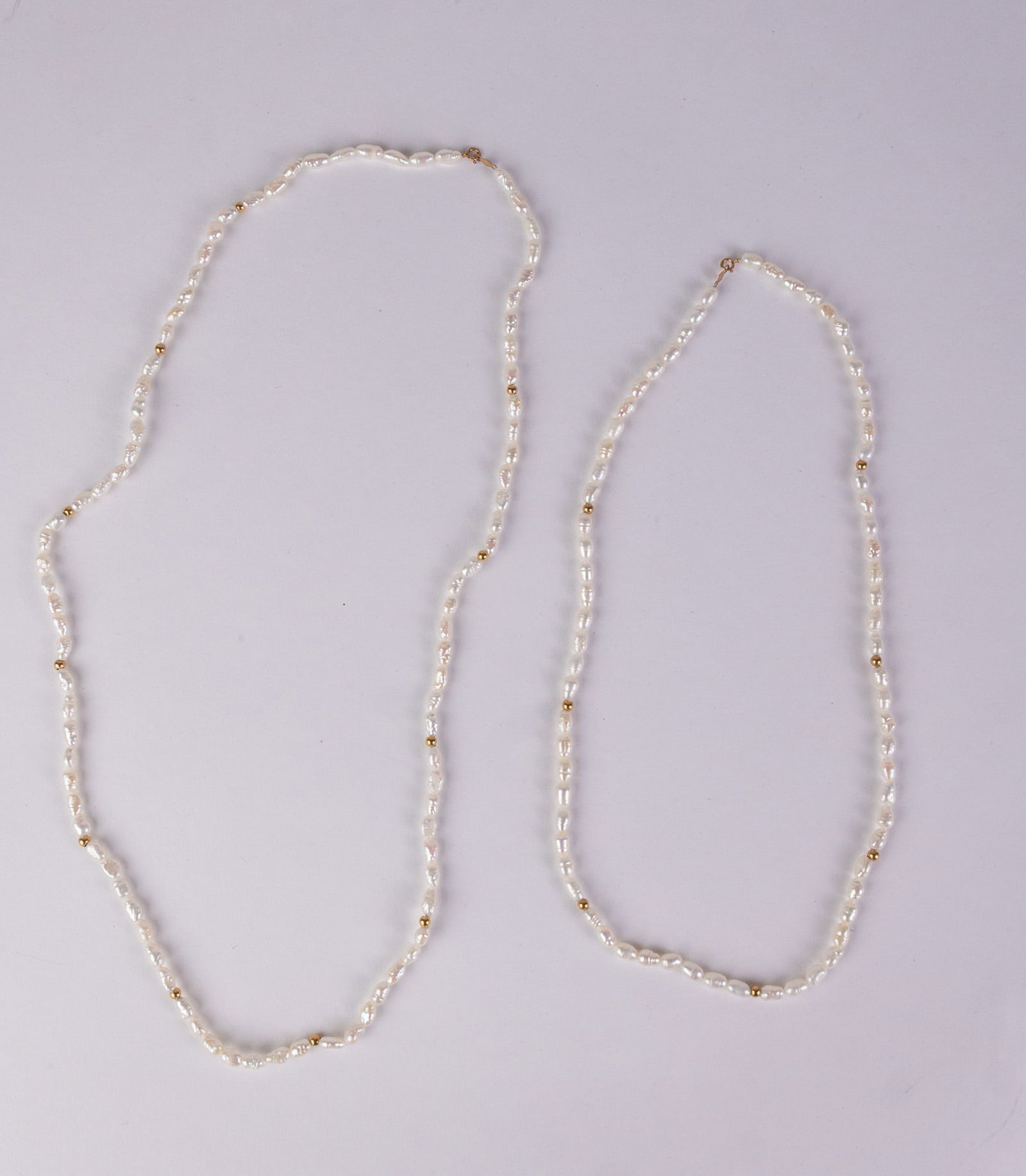 (2) Uncultured Pearl 14KY Gold Clasp Necklaces: marked "14K", total weightLiteratureBrooks Auction – Online Auction Terms & Conditions Contact: (856) 694-2960 | info@brooks.auction READ BEFORE YOU BID: We want you to feel confident when