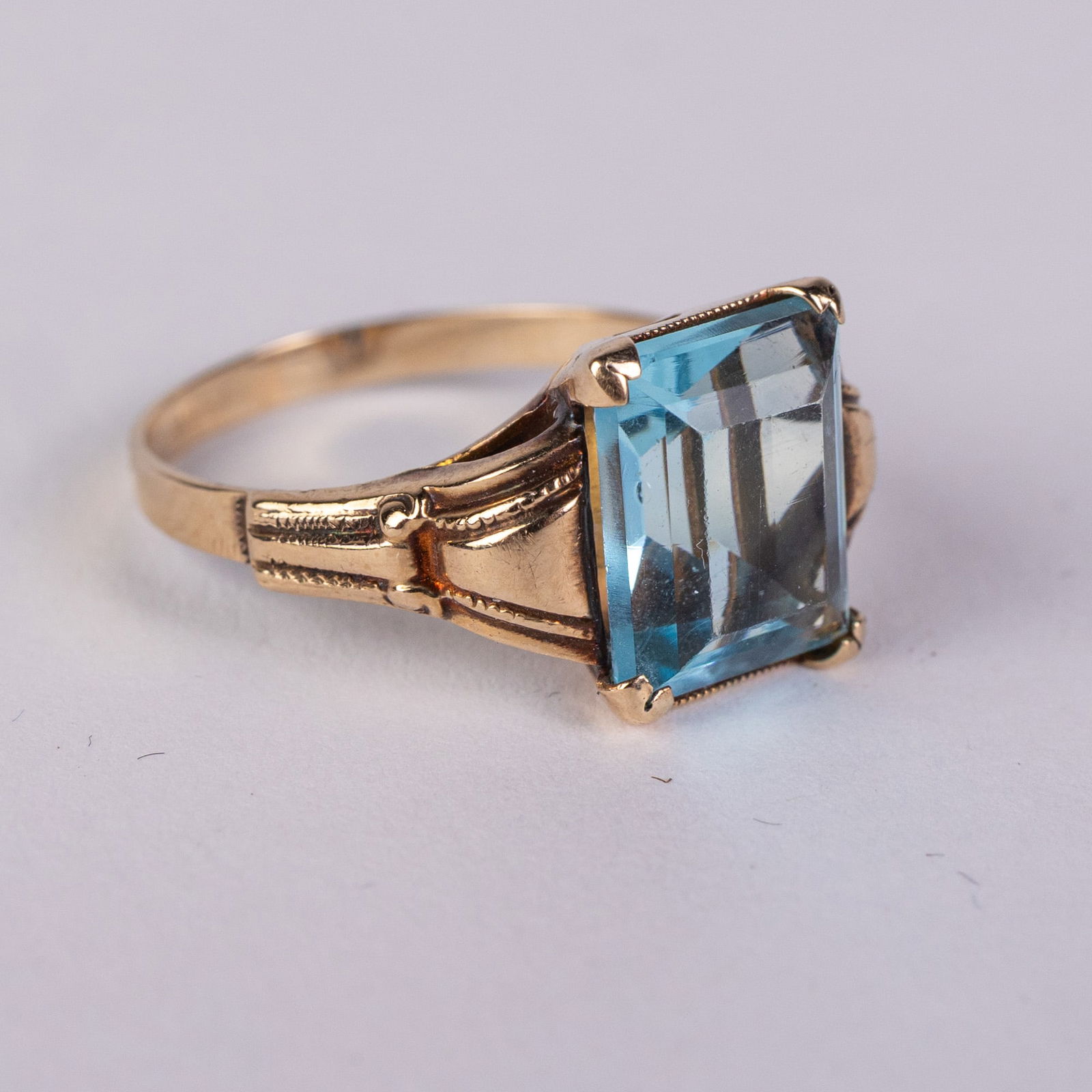 10KY Gold Blue Topaz Ring: Marked "CB 10K", size 7.5 , total weight 2.34 grams.LiteratureBrooks Auction – Online Auction Terms & Conditions Contact: (856) 694-2960 | info@brooks.auction READ BEFORE YOU BID: We want you